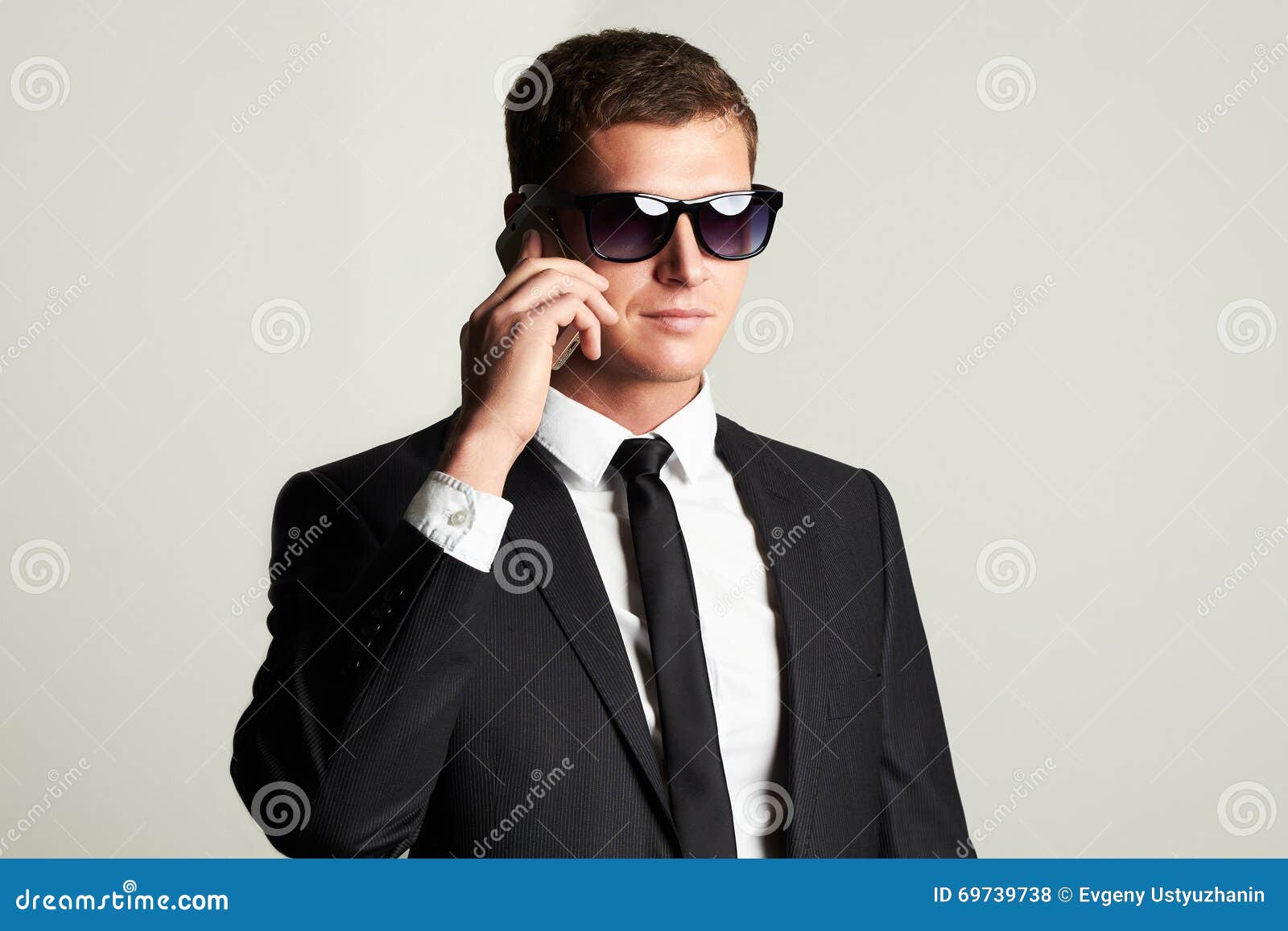 businessman-phone-handsome-man-suit-sunglasses-young-69739738.jpg