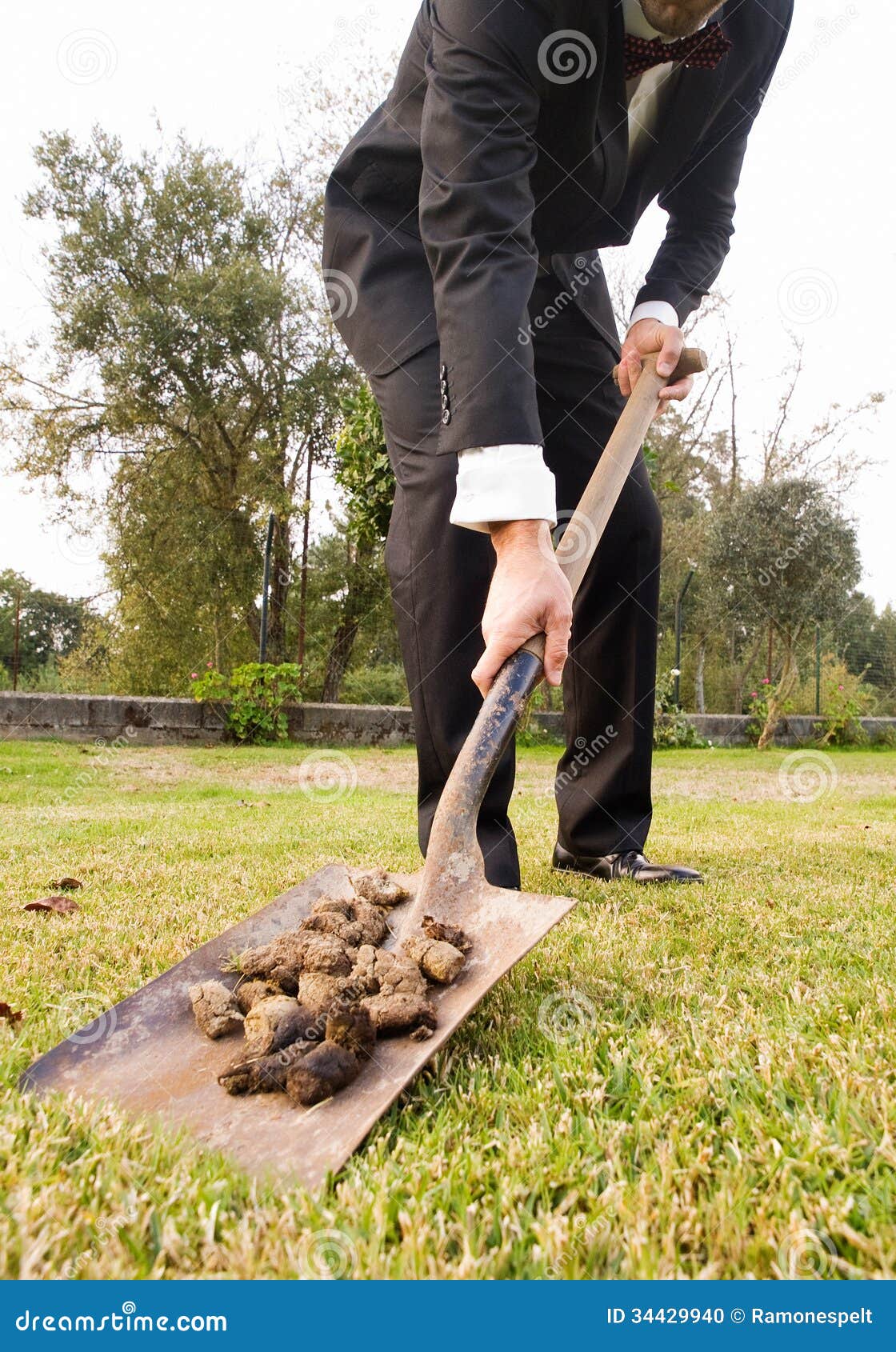 Businessman Picking Up Droppings with a Shovel Stock Photo Image of