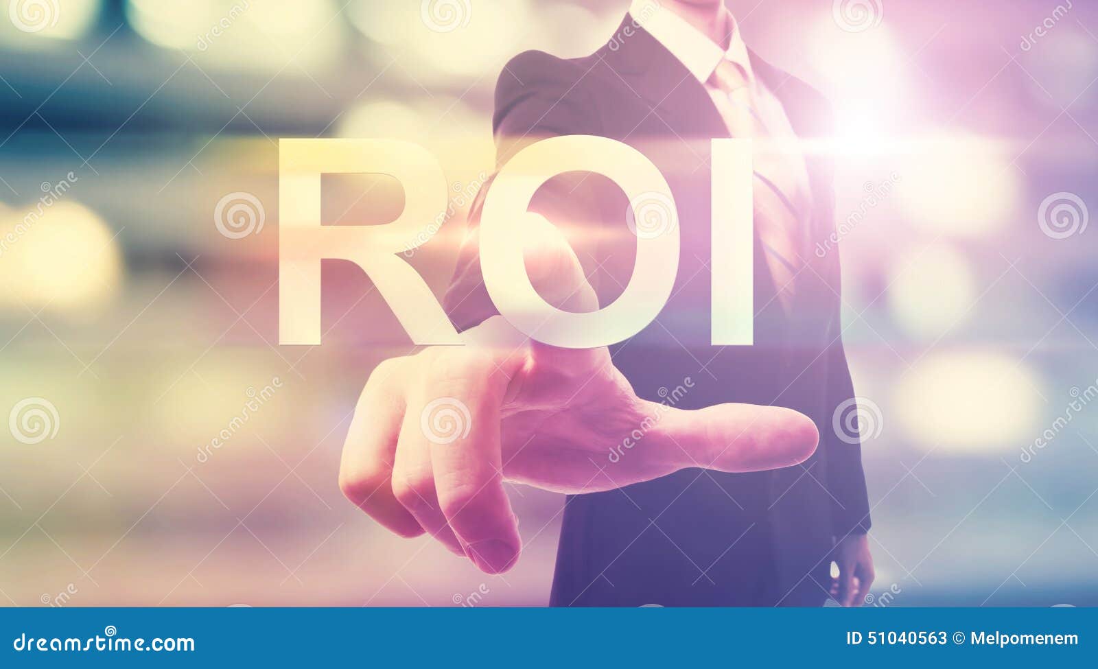 businessman pointing at roi (return on investment)