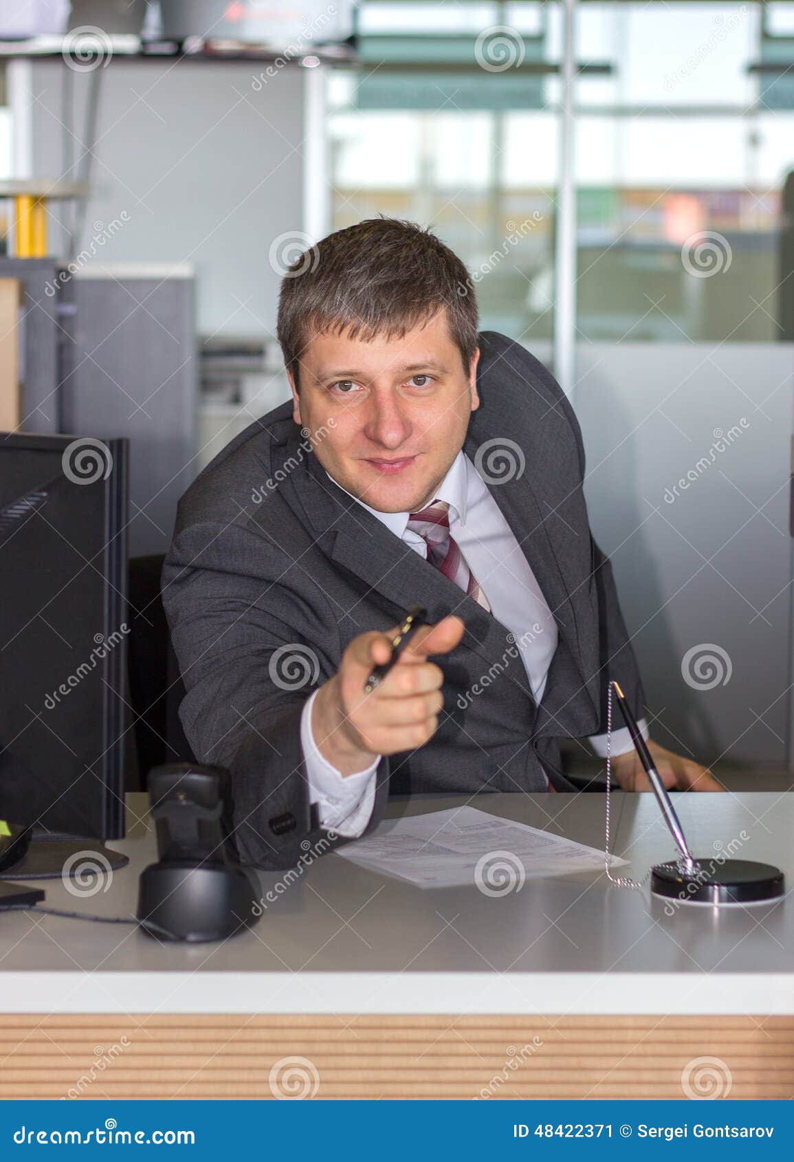 Businessman pointing on you in bank