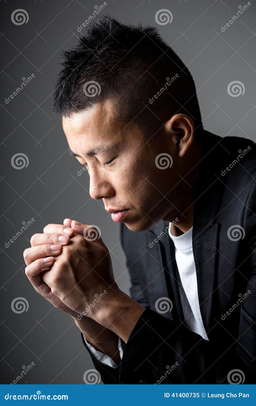 Businessman pray on white