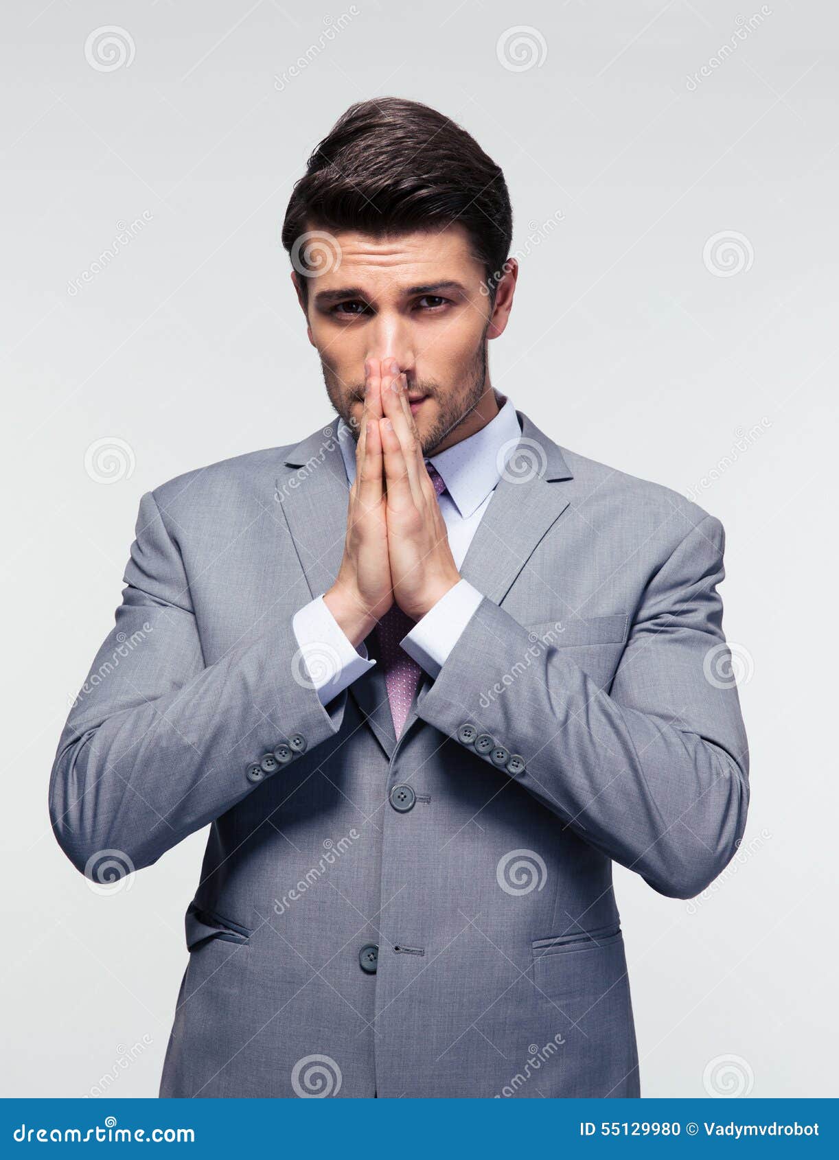 Businessman Praying Over Gray Background Stock Photo - Image of hand ...