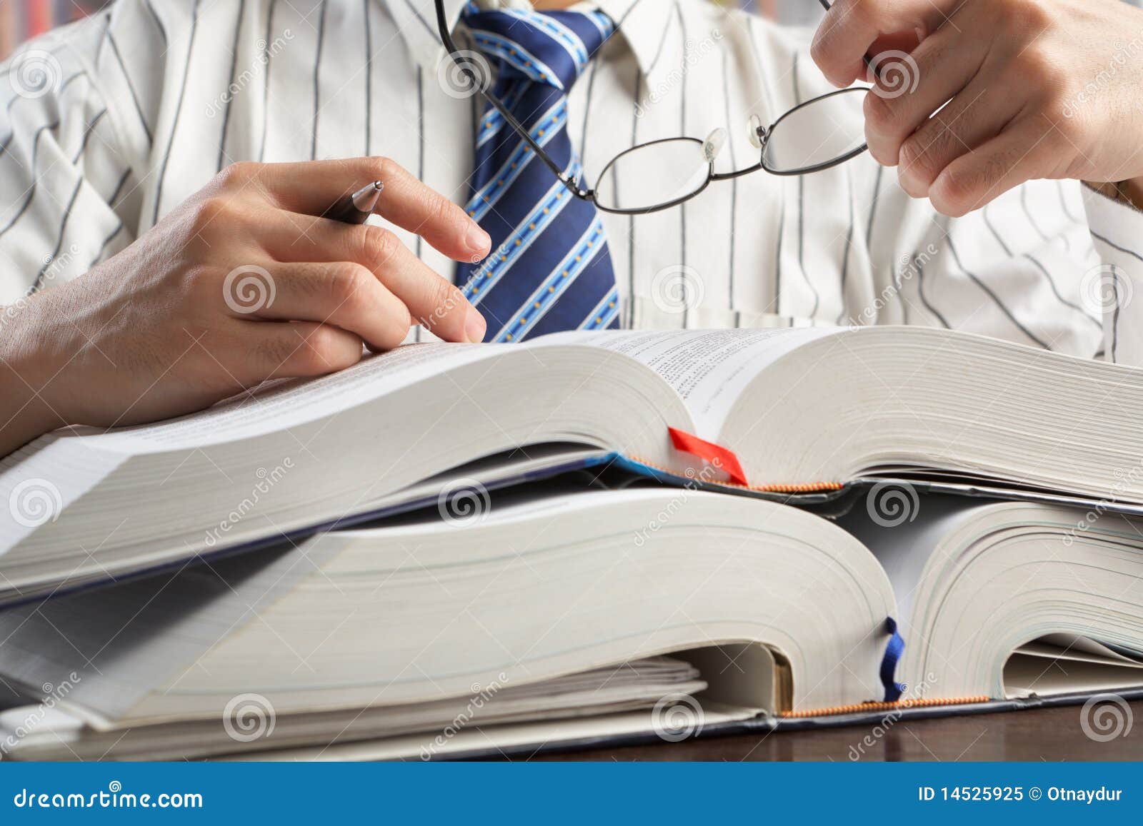 businessman or professor reading journal