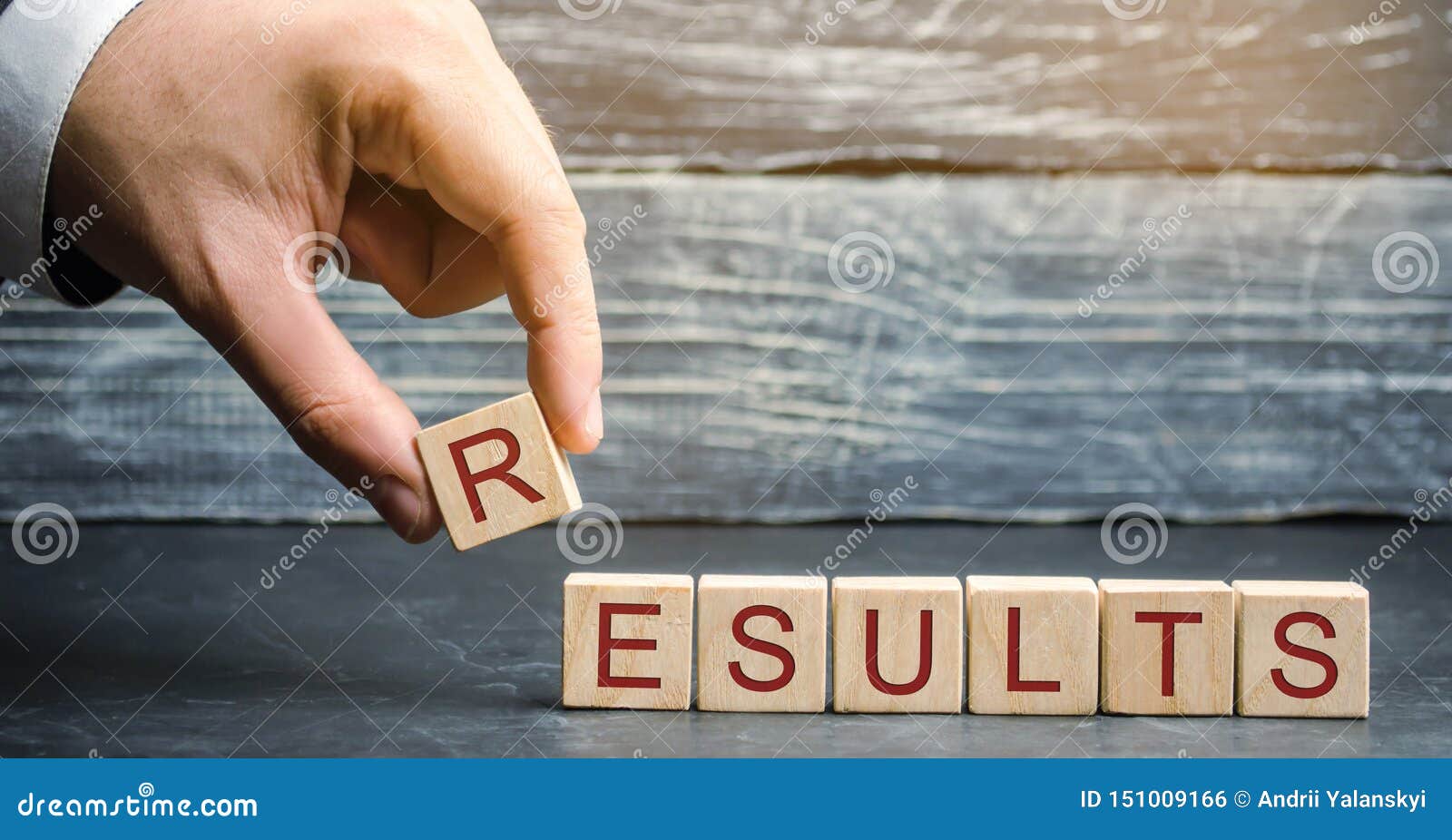 businessman puts wooden blocks with the word results. the concept of annual financial statements. analysis of profits and revenues
