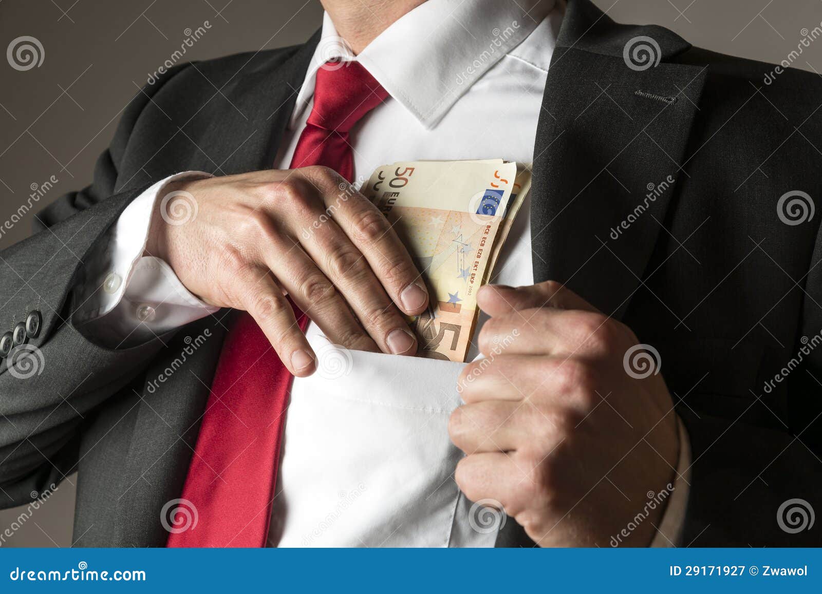 Businessman Putting Money in Pocket Stock Image - Image of money ...