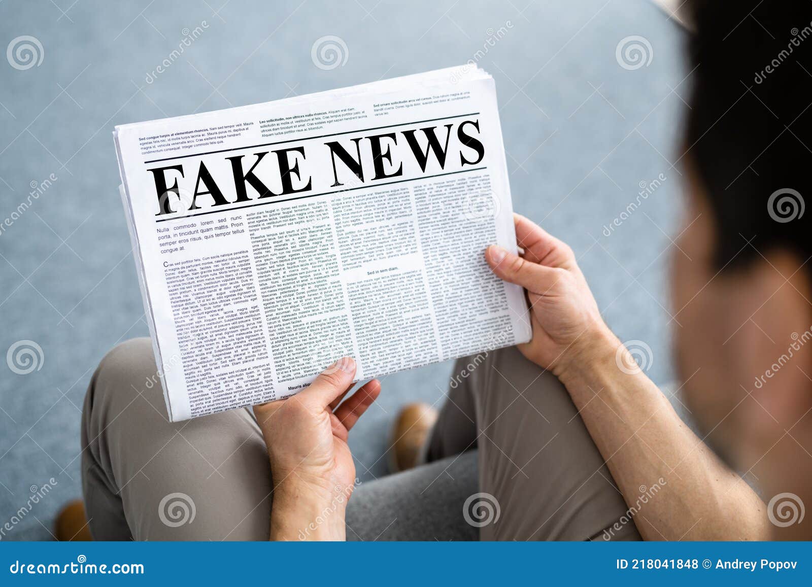 Businessman Reading Fake News Article on Newspaper Stock Photo - Image ...