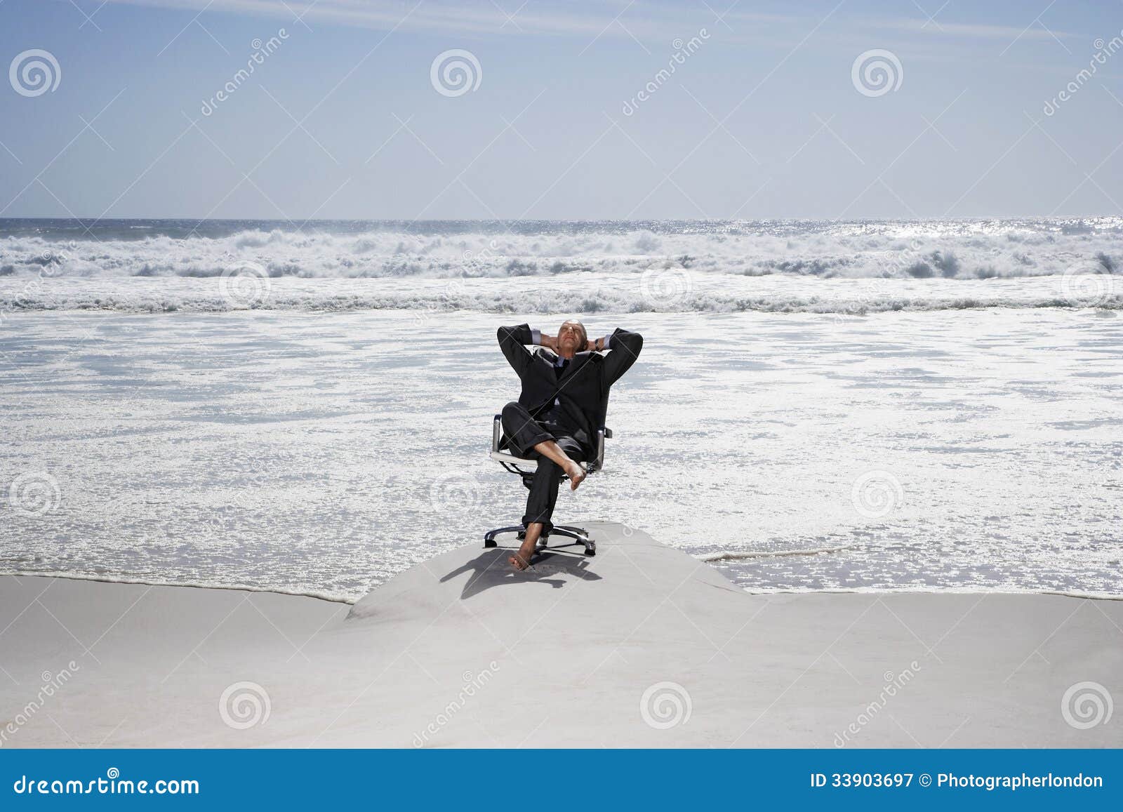 businessman relaxing on chair at beach