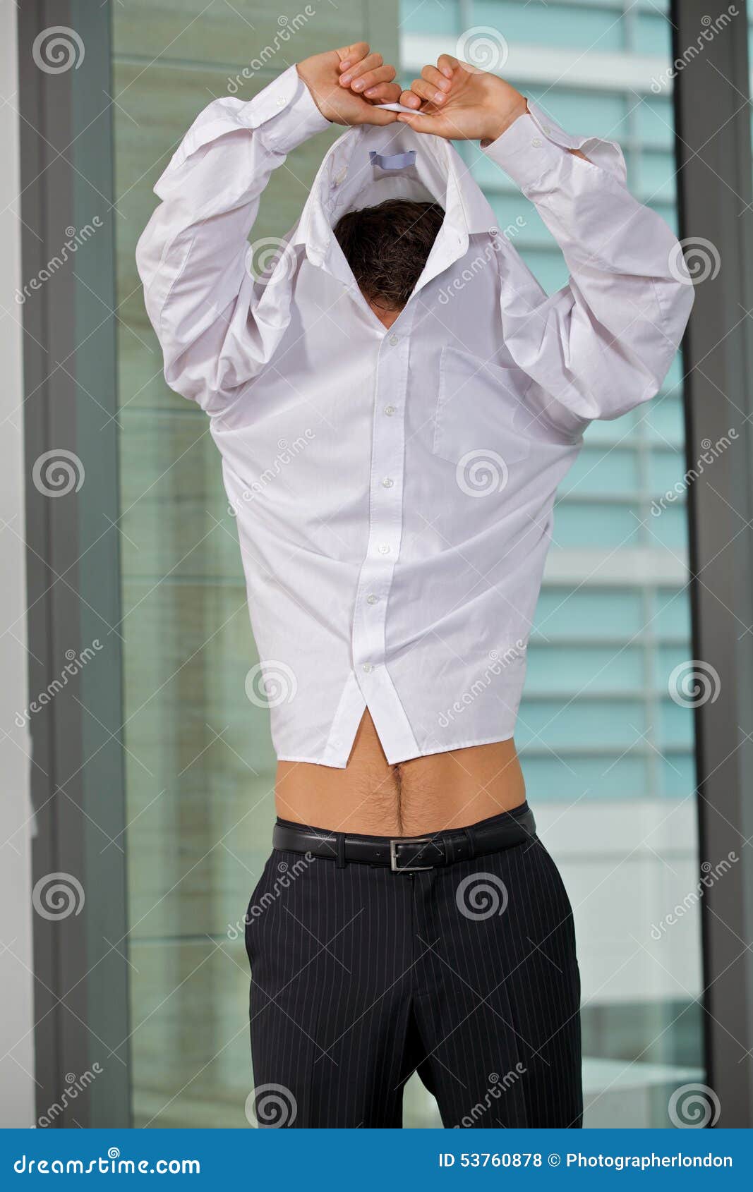 Businessman Removing Shirt at Office Stock Photo Image of business