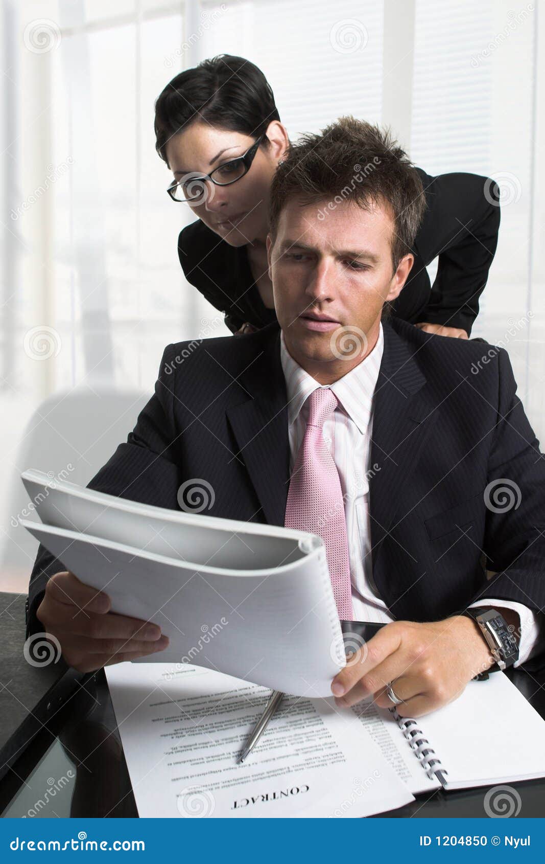 Businessman Reviews a Document Stock Photo - Image of businessteam