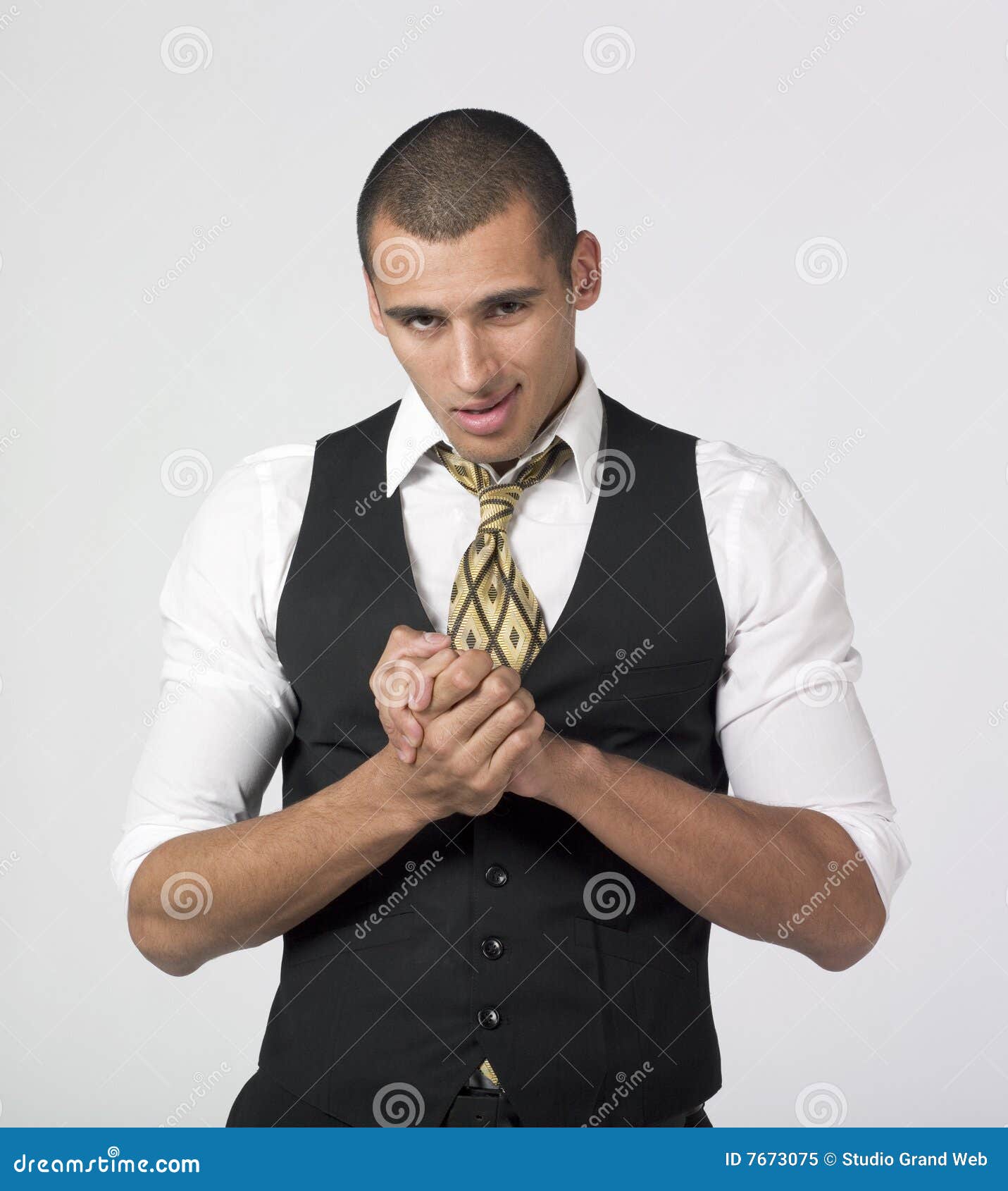 businessman rubbing hands with a smirk