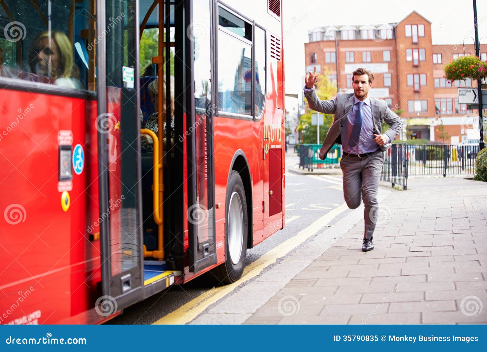 businessman running to catch bus stop