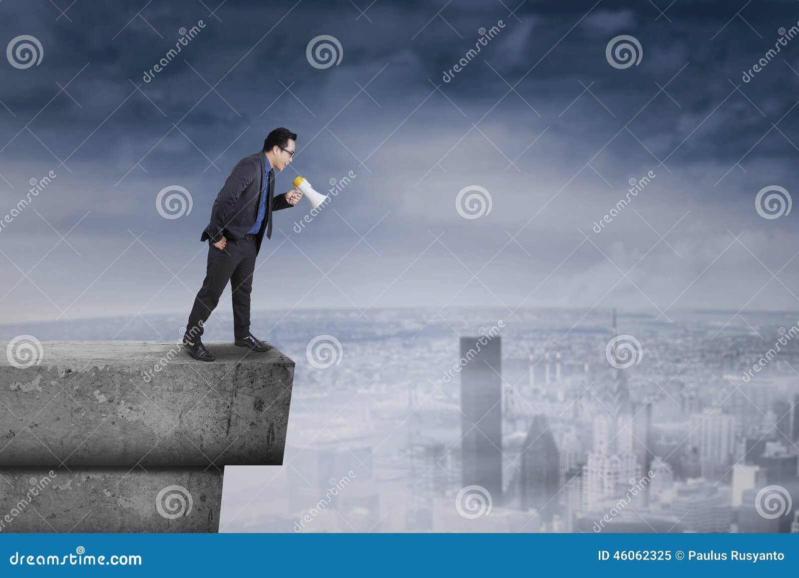 businessman screaming from the rooftop