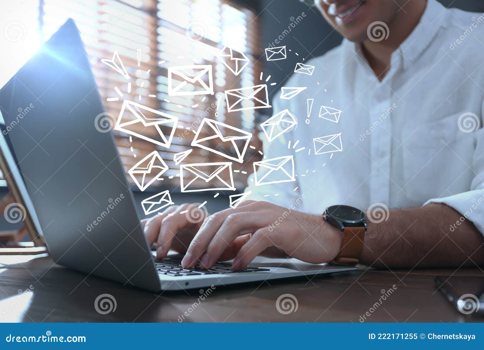 businessman sending emails at table, closeup
