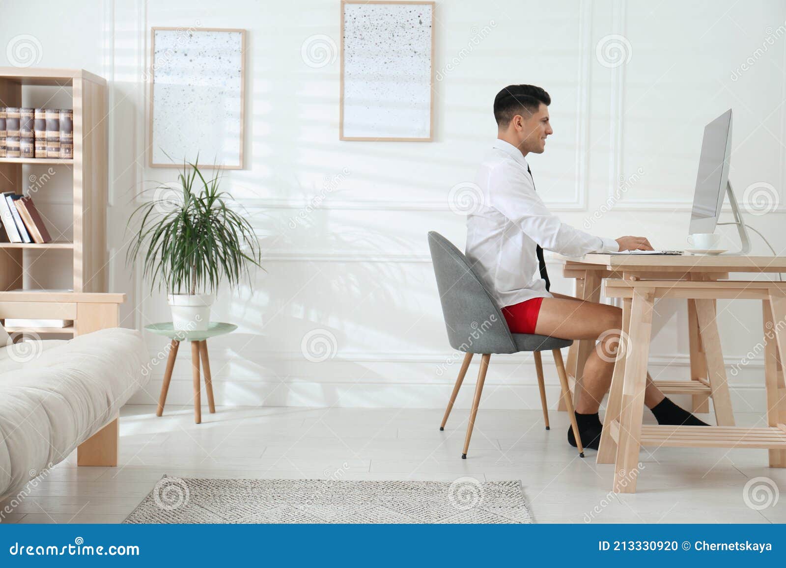 Businessman in Shirt and Underwear Working on Computer at Home Office ...