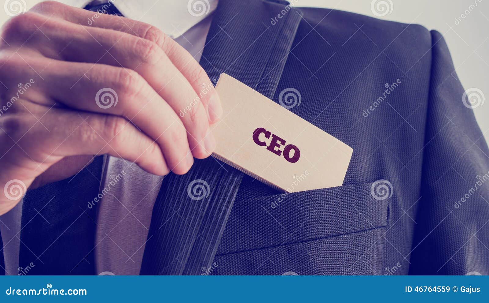 businessman showing a card reading ceo