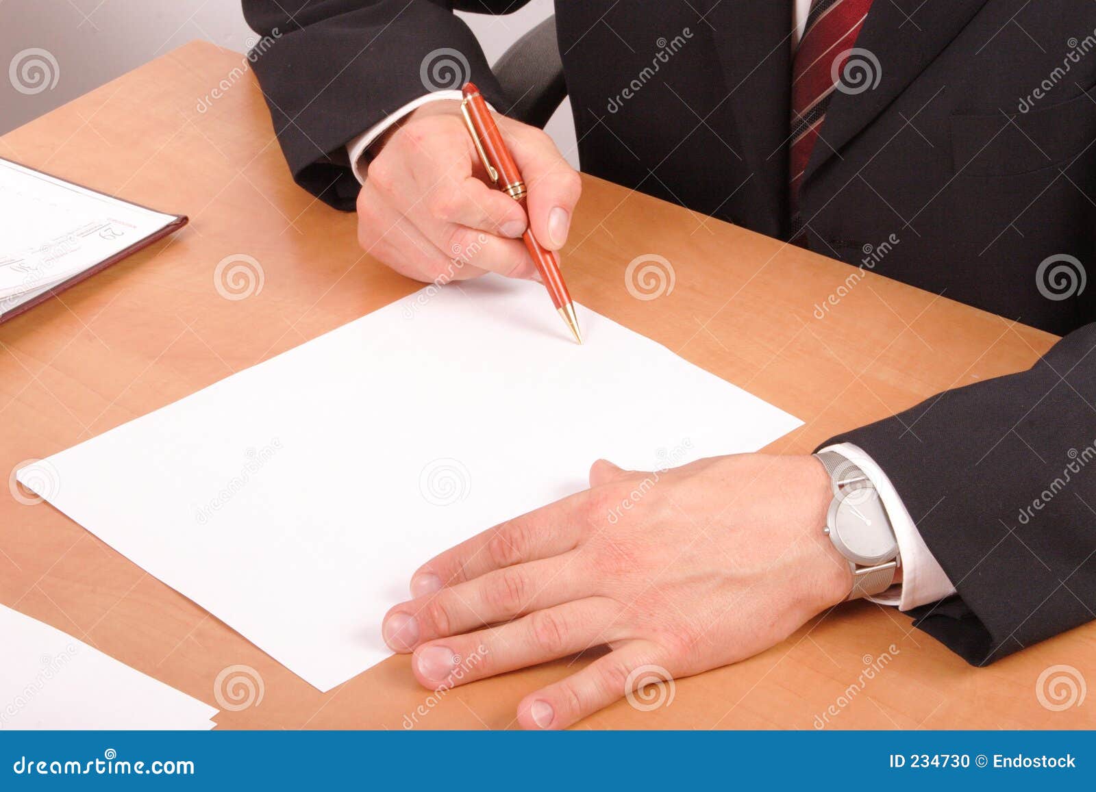 businessman signing papers