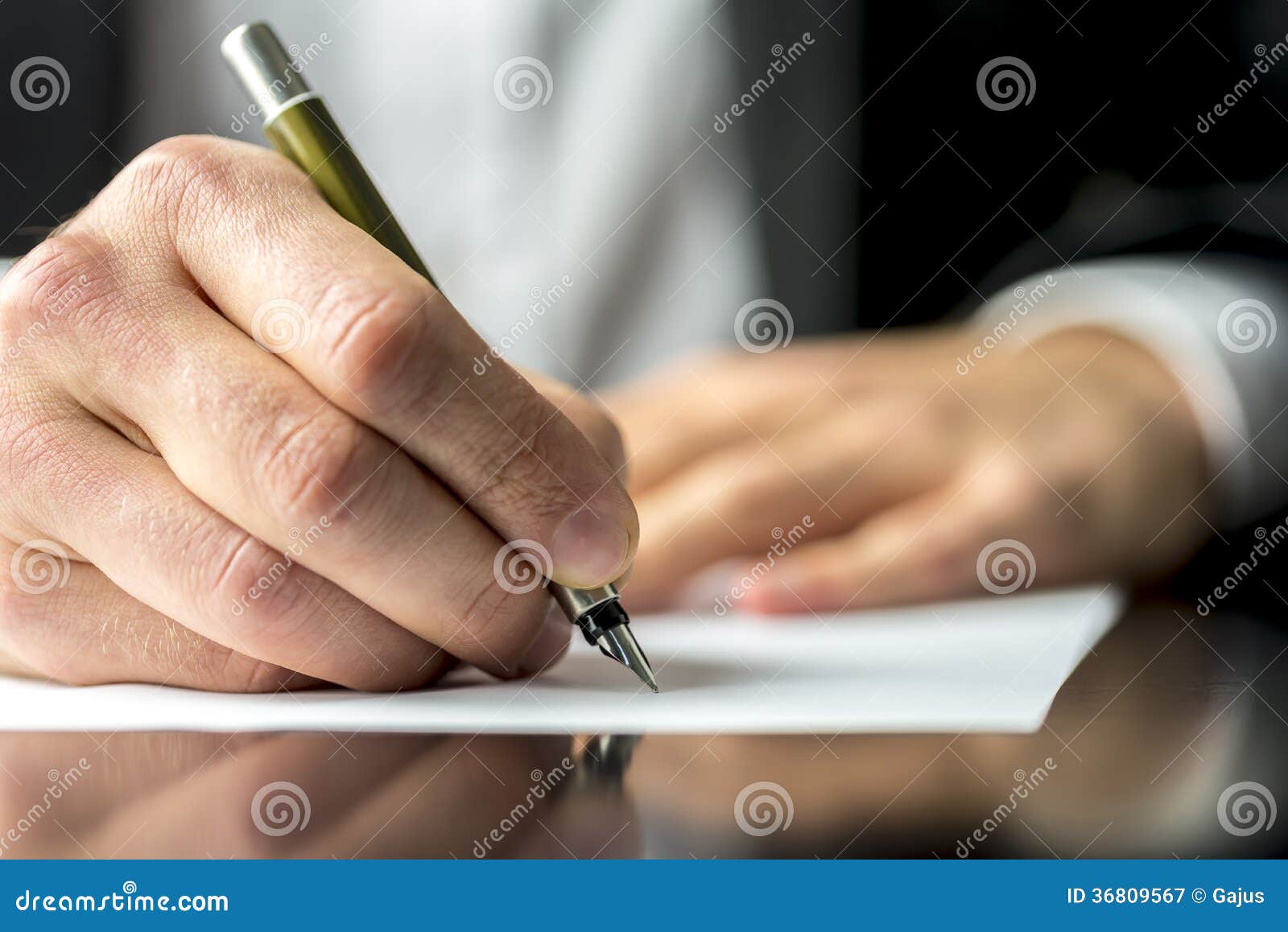 businessman signing or writing a document