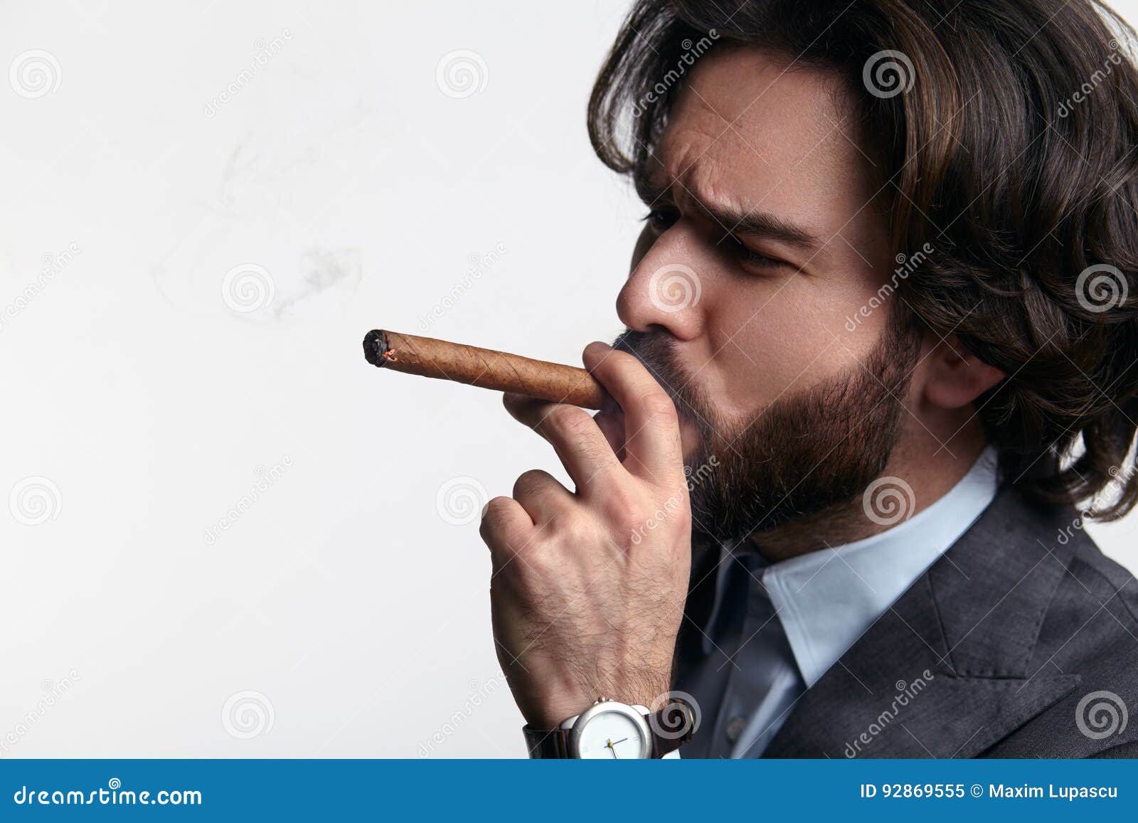 Businessman smoking cigar stock image. Image of male 92869555