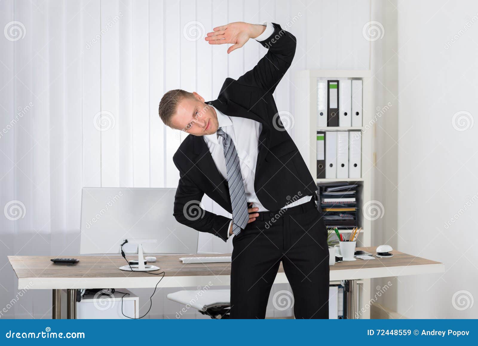 Businessman Stretching in Office Stock Image Image of calculator