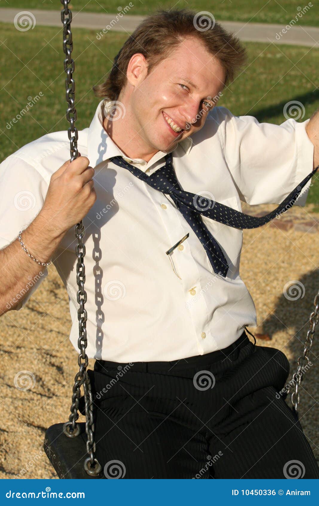 Businessman on a swing stock photo. Image of active, playground 10450336