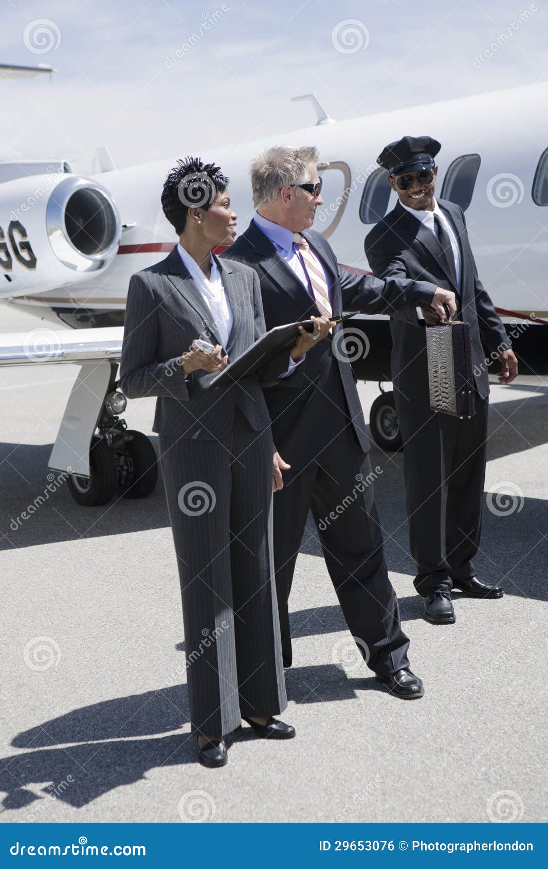 Businessman Taking Briefcase from Driver at Airfield Stock Photo Image of multiethnic, senior