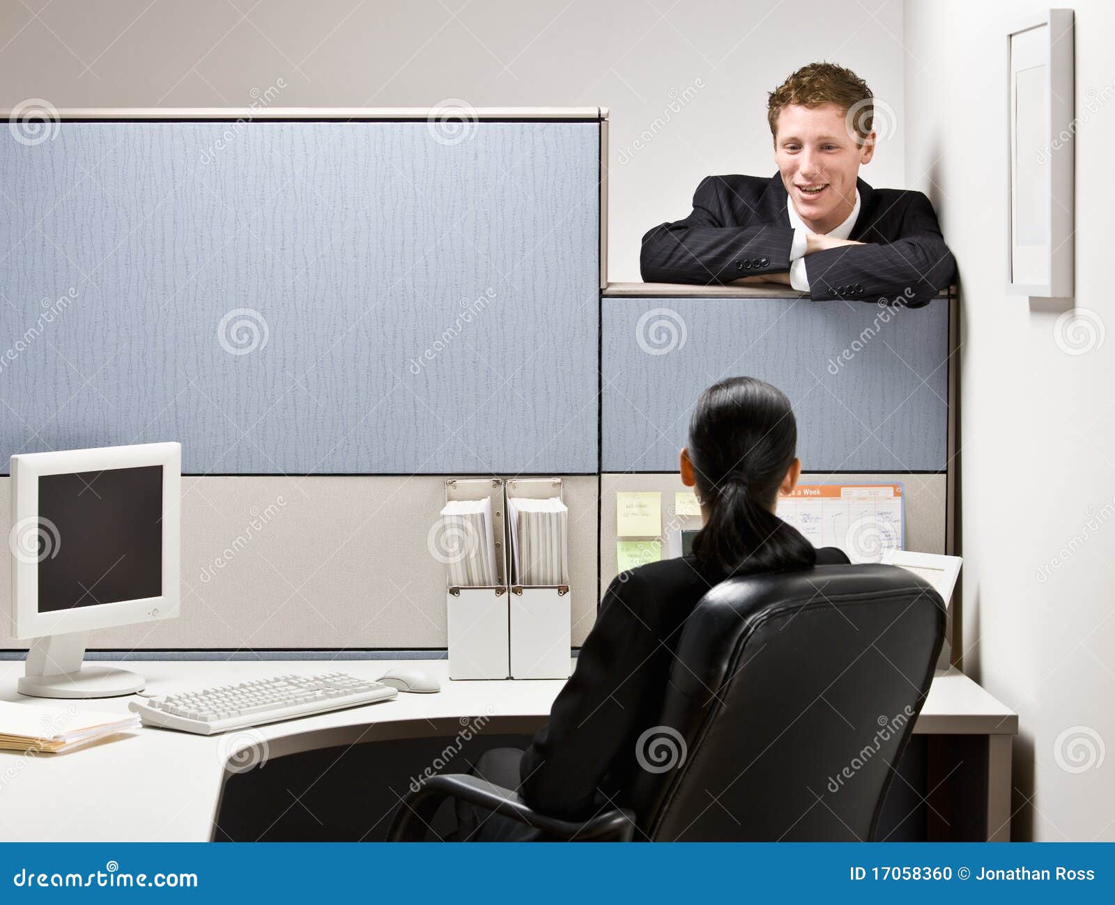 businessman talking to co-worker