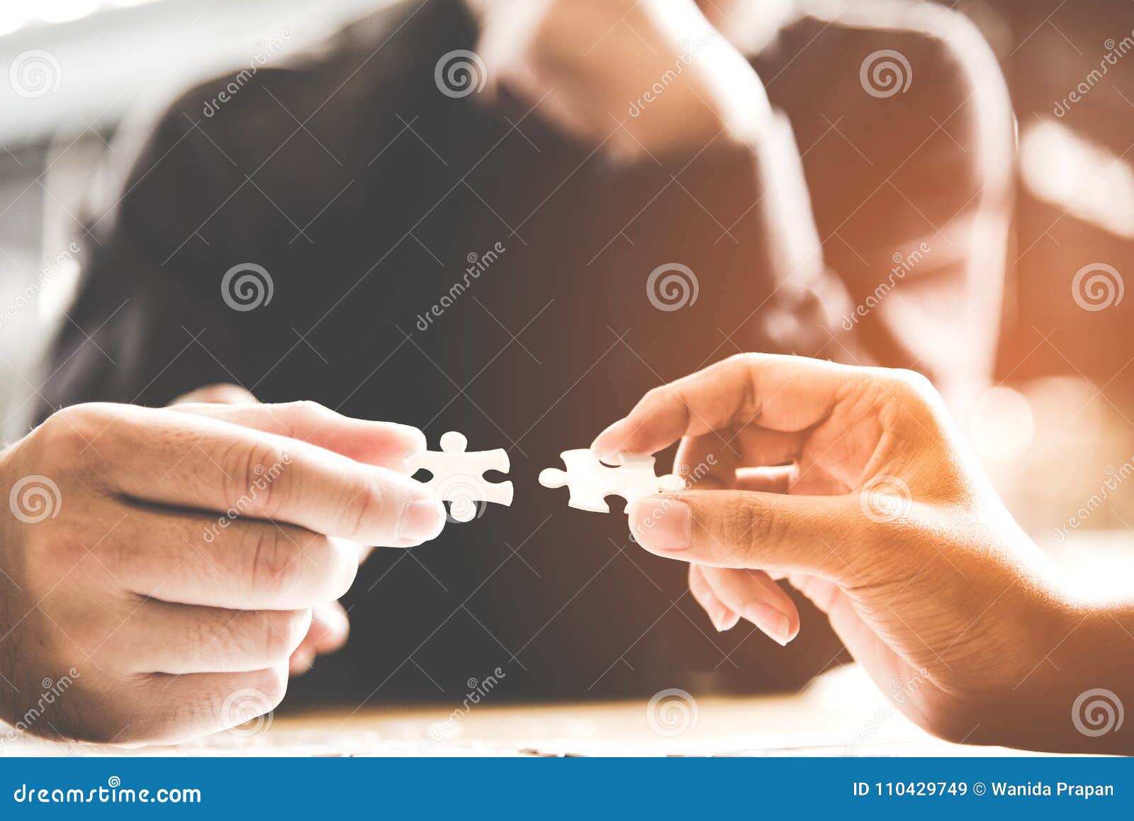 businessman team work holding two jigsaw connecting couple puzzle piece for matching to goals target, success and start up new pro