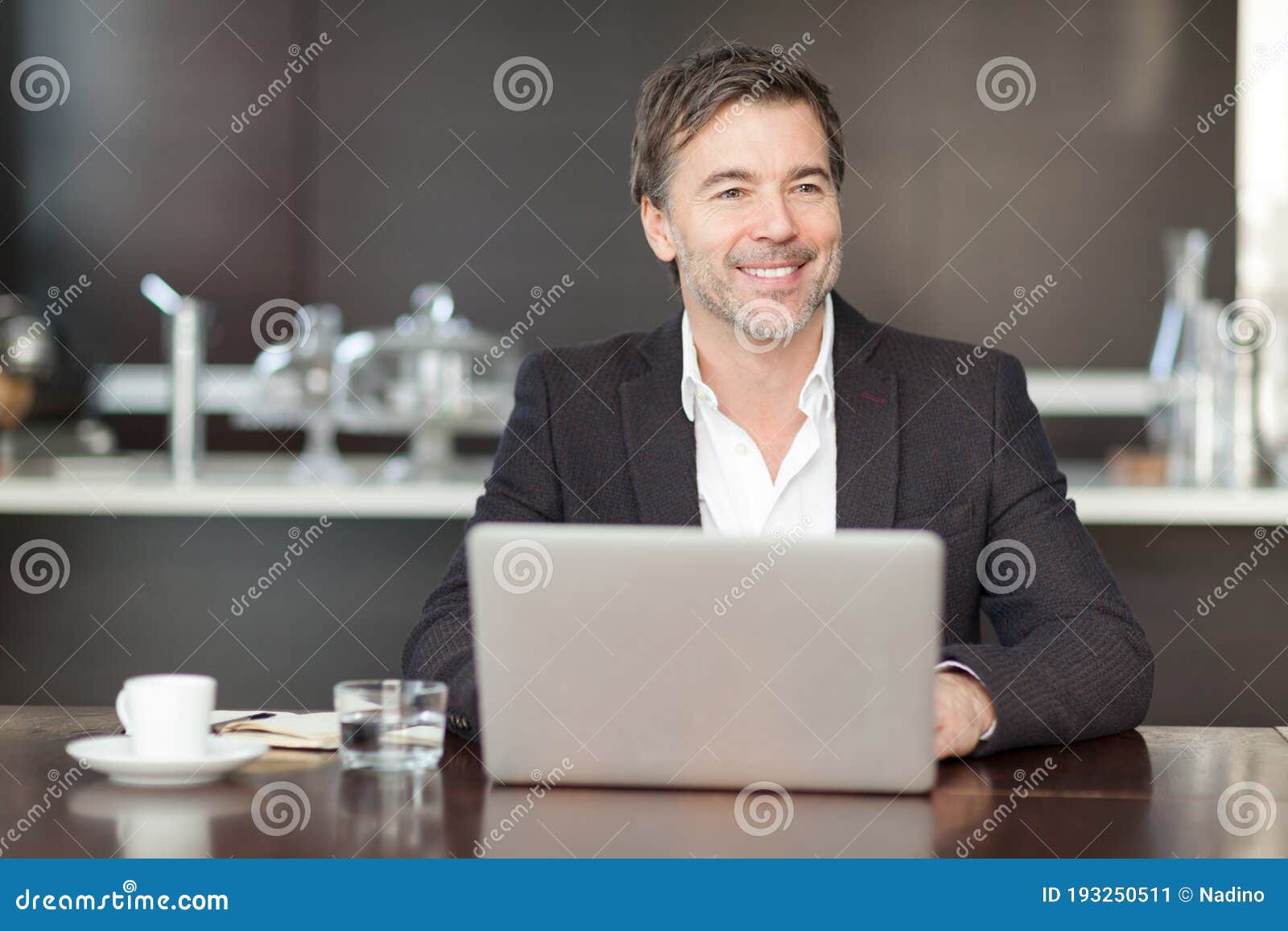 businessman teleworking at home smiling at the children