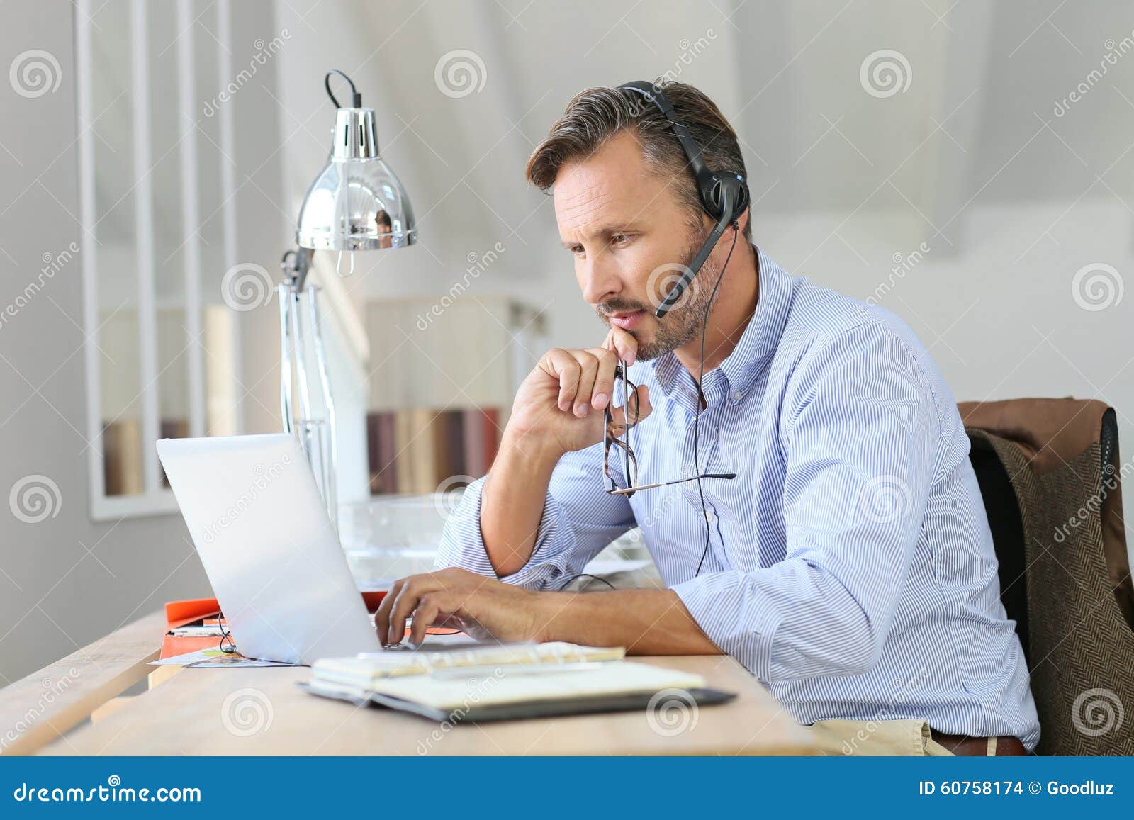 businessman teleworking on laptop