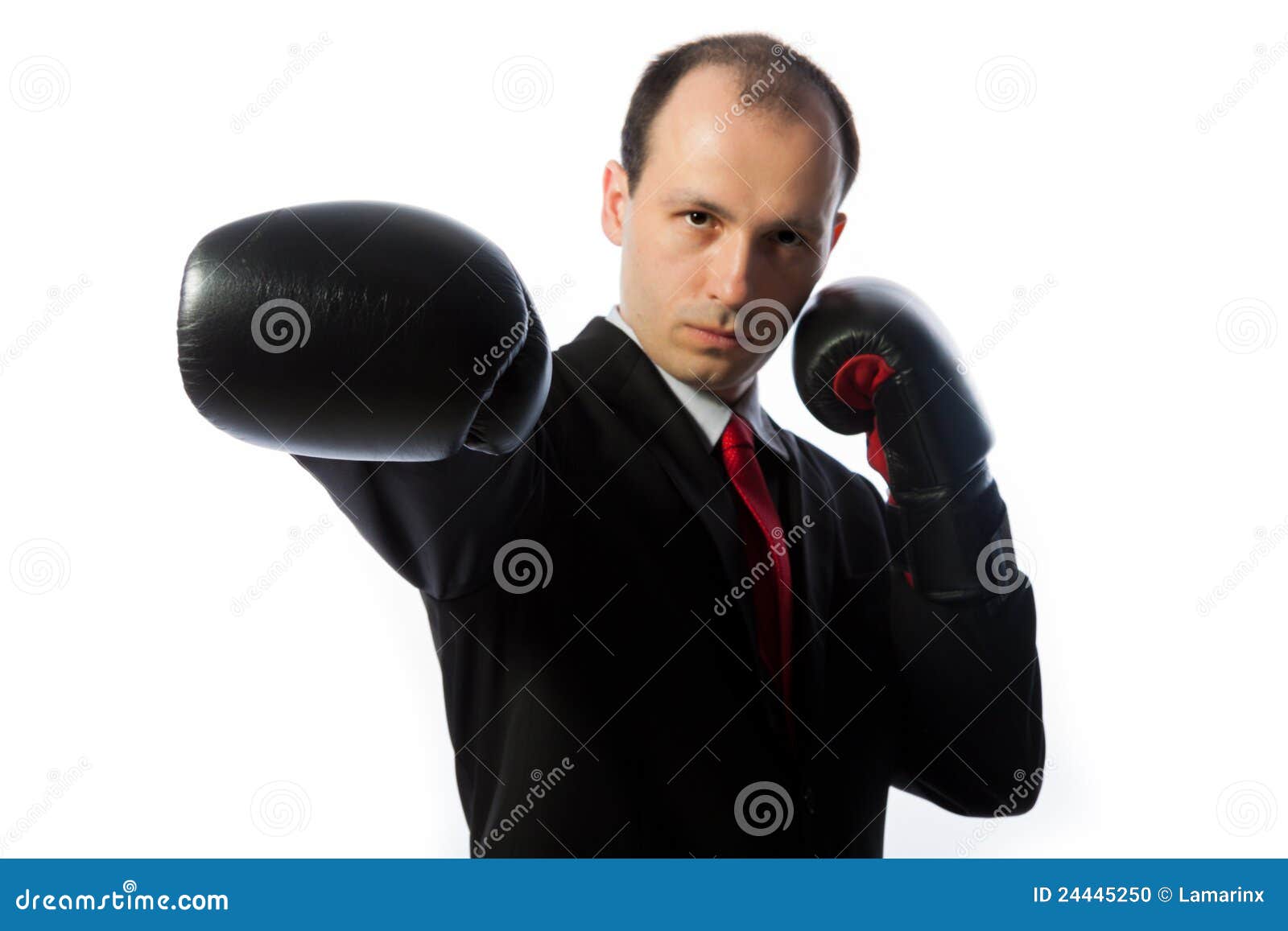 Businessman with a Tie and Boxing Gloves Punching Stock Photo Image