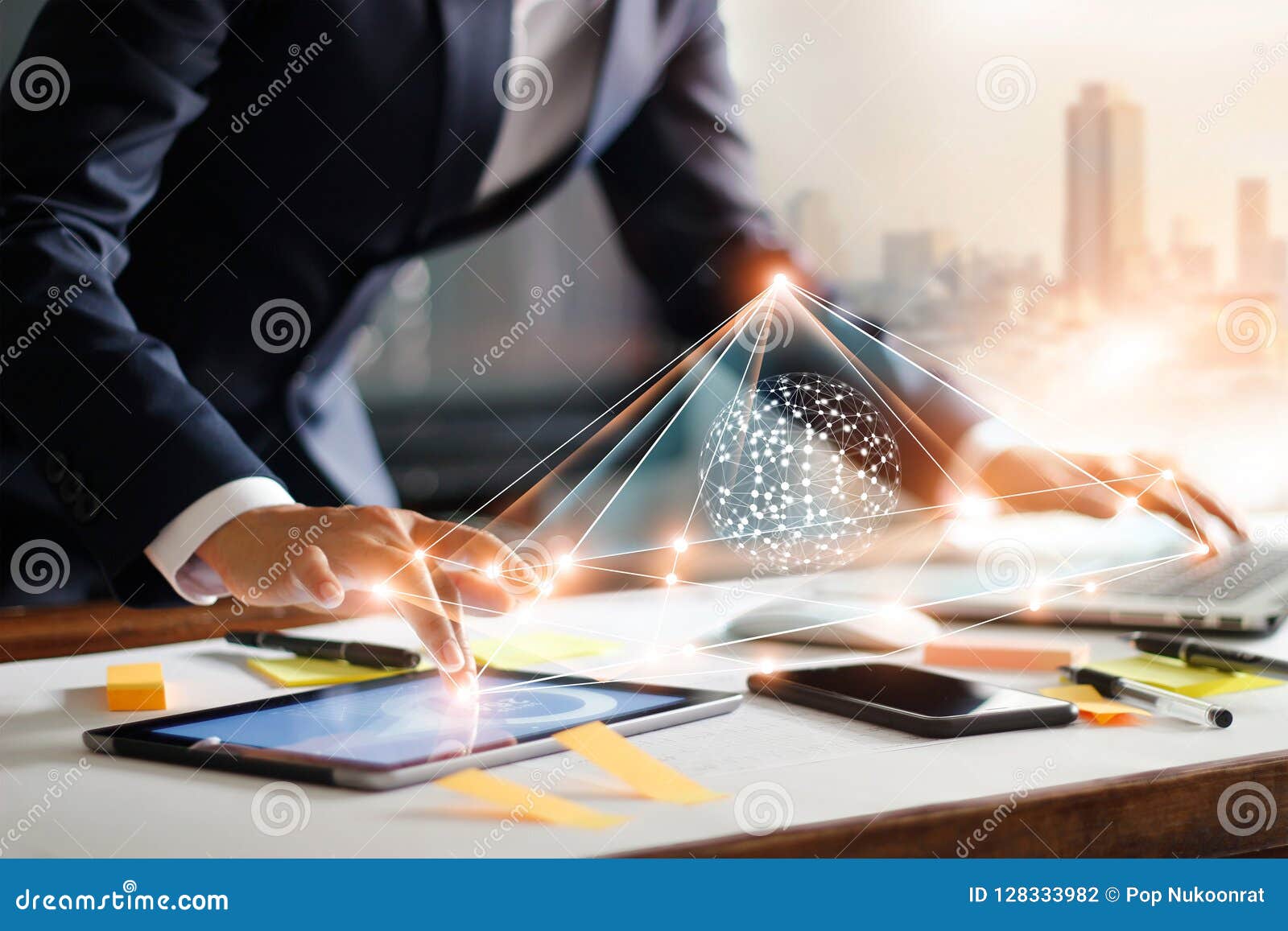 businessman touching tablet and laptop. managing data exchange