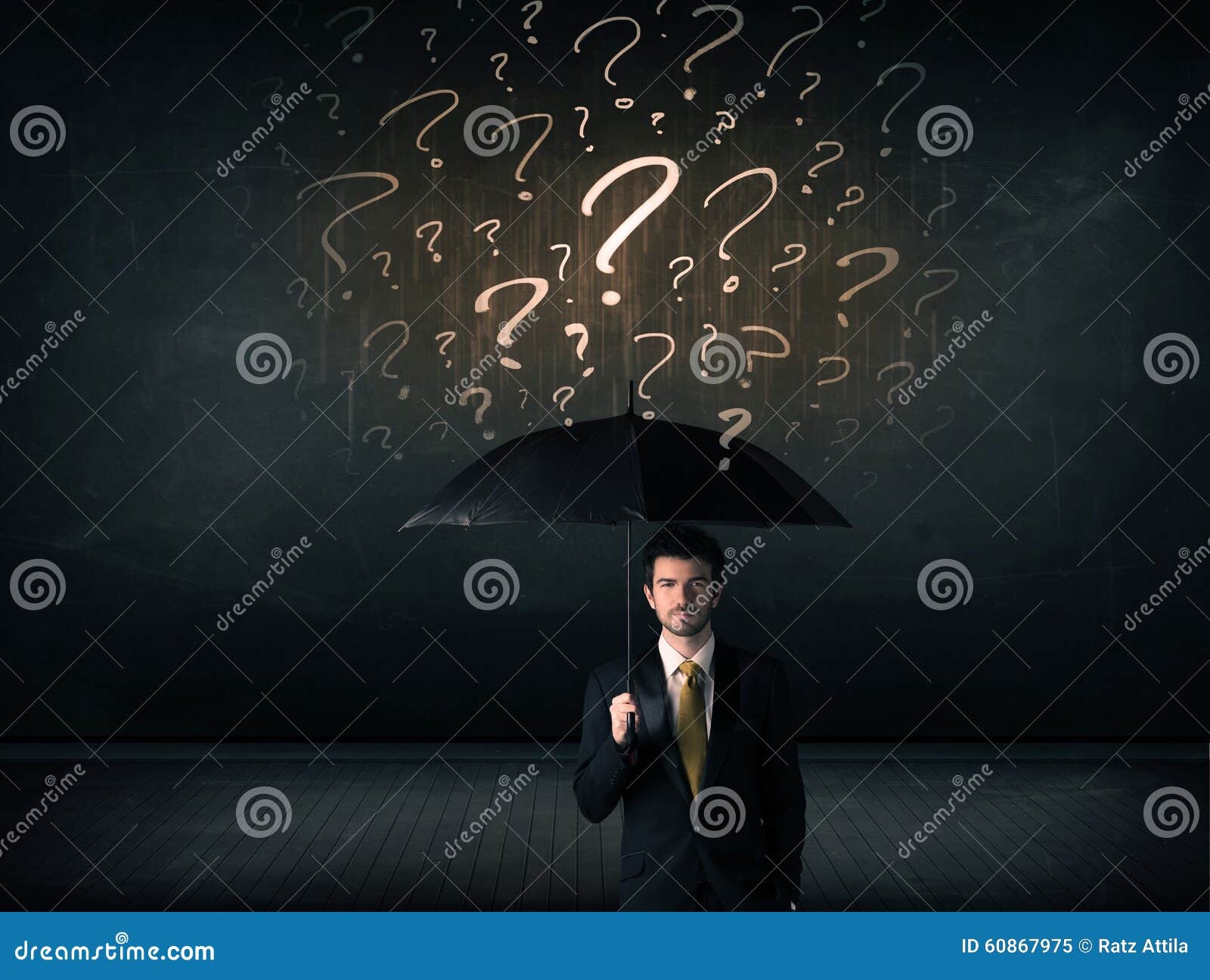 Businessman with Umbrella and a Lot of Drawn Question Marks Stock