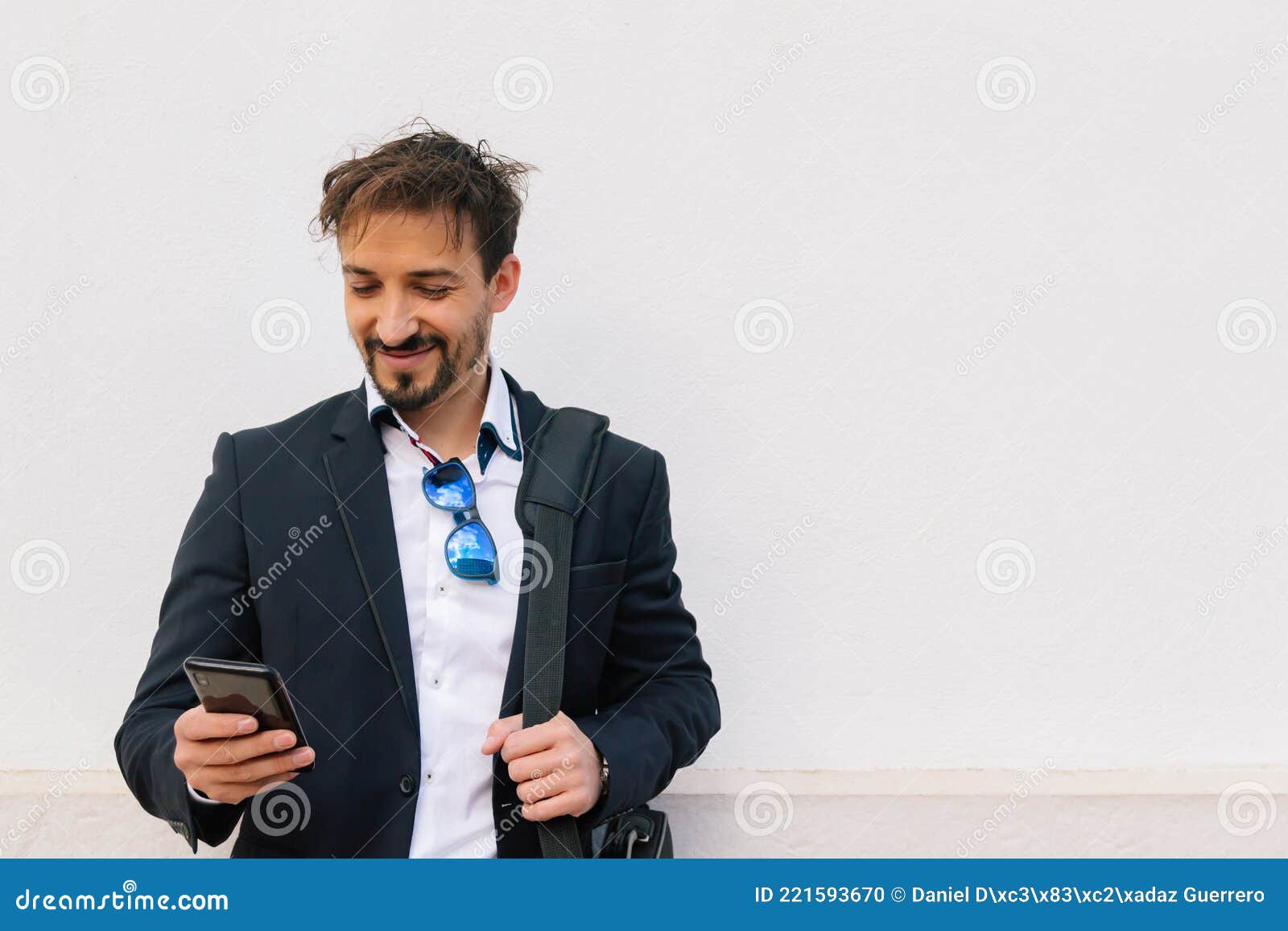 businessman using his smartphone on white background