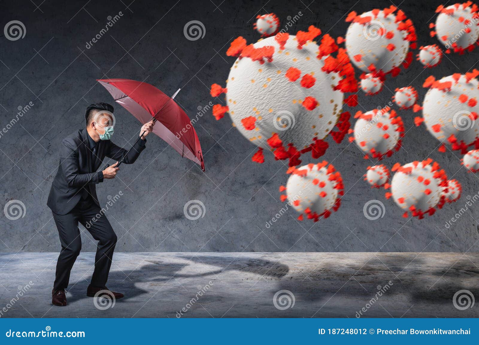 the businessman using an umbrella for defending coronavirus pandemic. the concept of insurance, protection, business and health ca