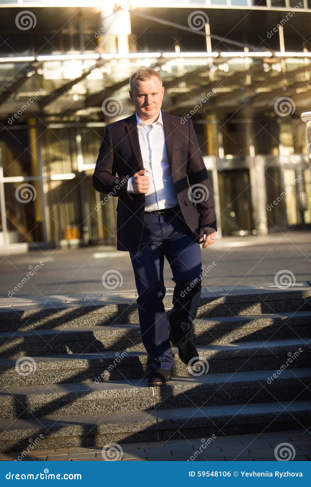 Businessman Walking Down the Stone Stairs at Business Center Stock ...