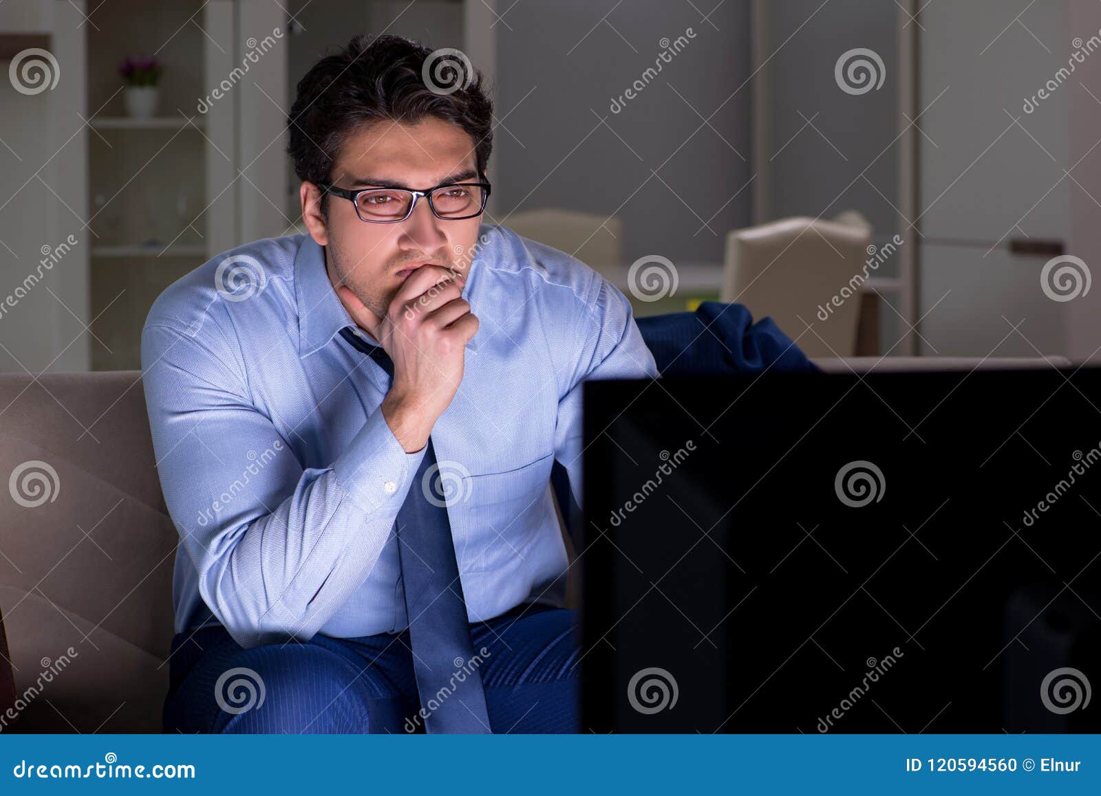 The Businessman Watching  Tv  At Night  Late Stock Photo 
