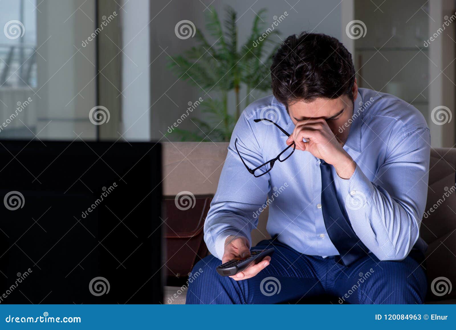 The Businessman Watching  Tv  At Night  Late Stock Image 
