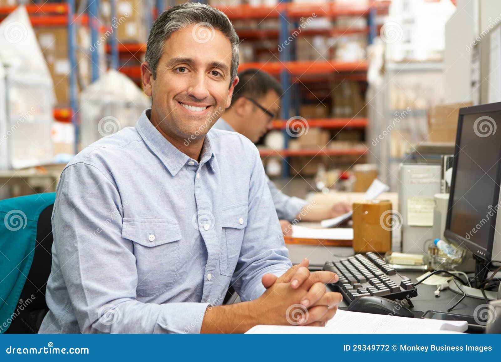 Businessman Working at Desk in Warehouse Stock Photo Image of camera, order 29349772