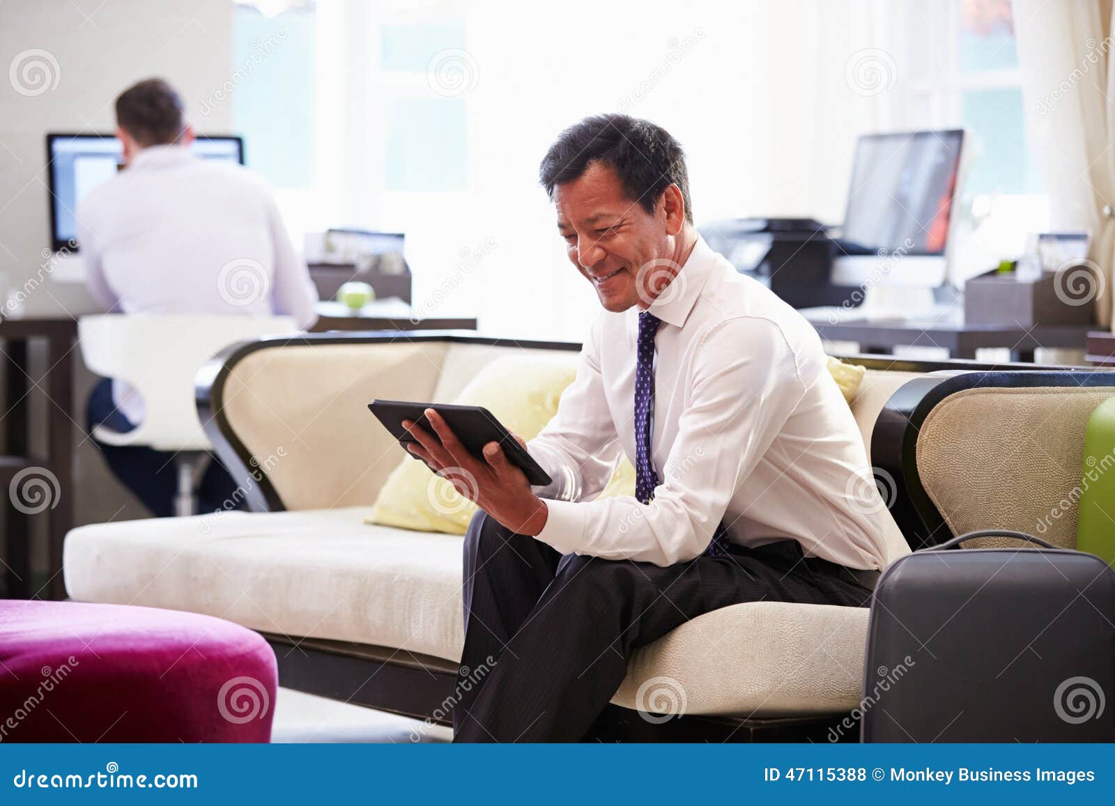 Businessman Working on Digital Tablet in Hotel Lobby Stock Photo Image of tablet, hotel 47115388