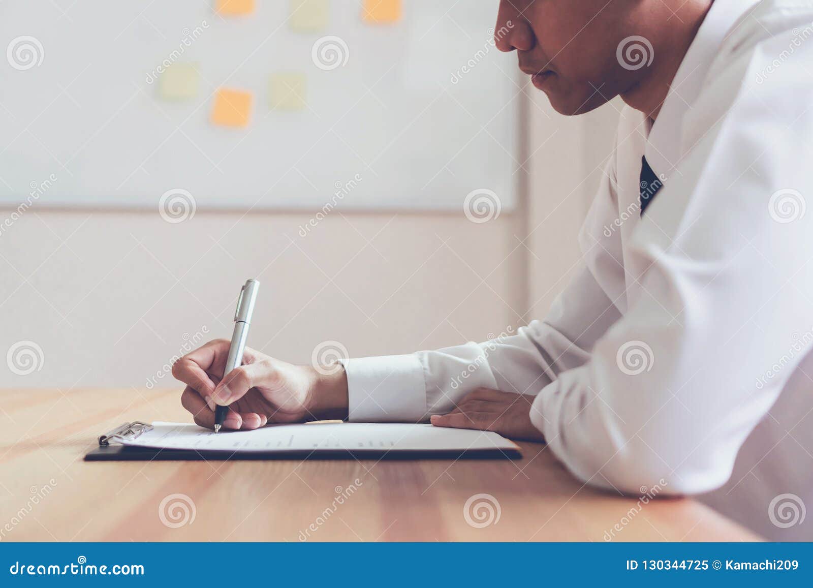 businessman writing form submit resume employer to review review resumes online