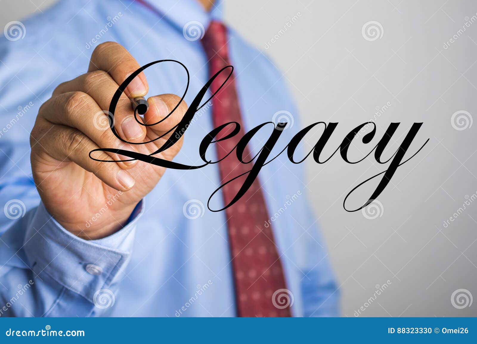 businessman writing legacy word on virtual screen