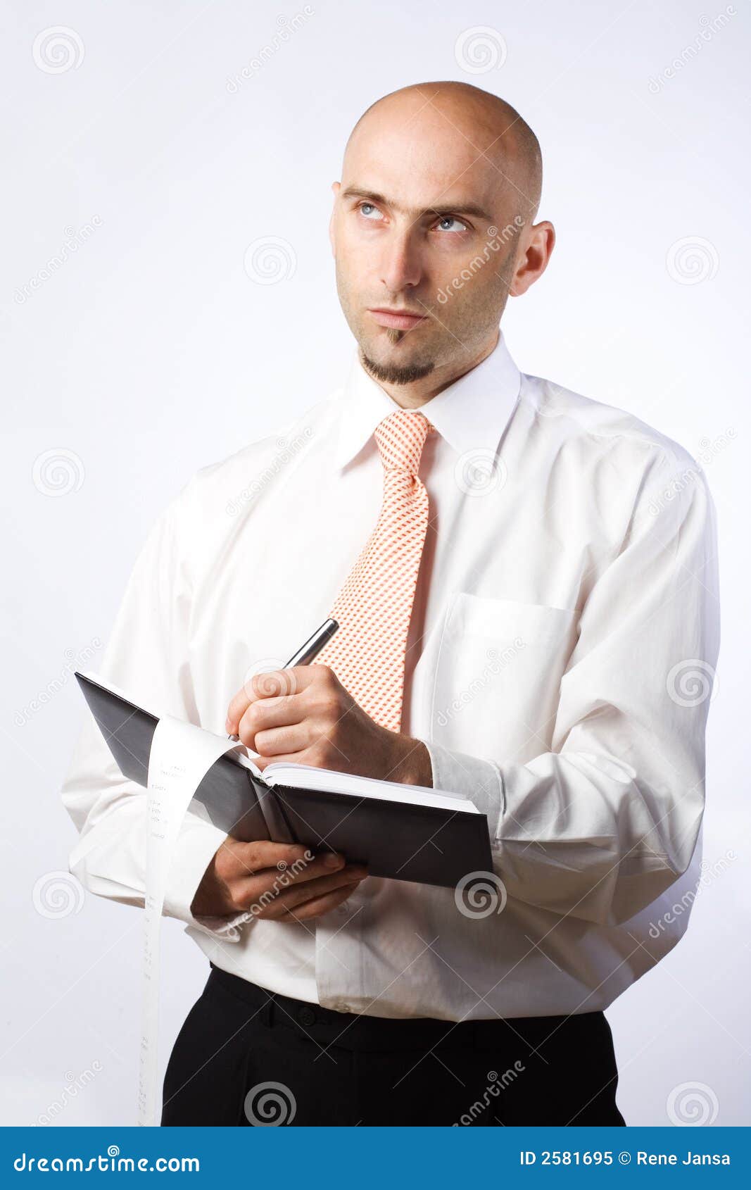 Businessman writing notes stock image. Image of thoughtful 2581695