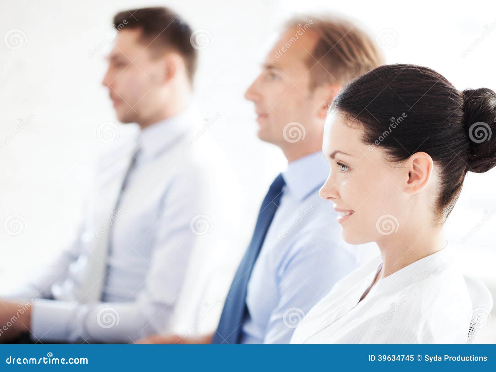 Picture of smiling businessmen and businesswomen on conference