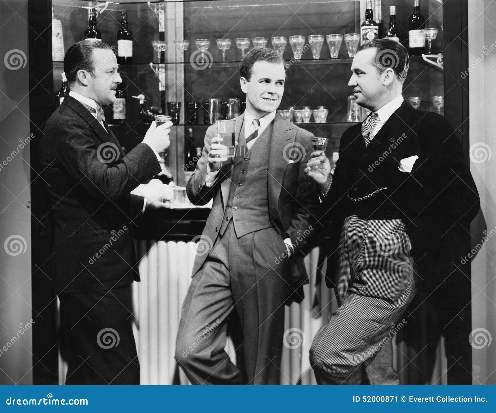 businessmen drinking together at bar