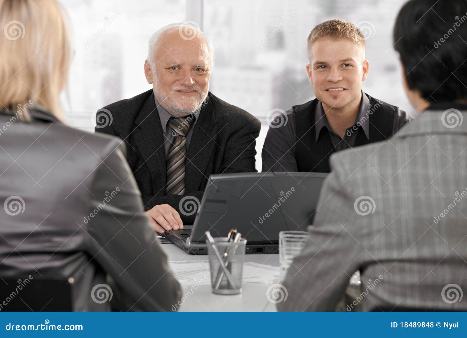 businessmen meeting with businesswomen