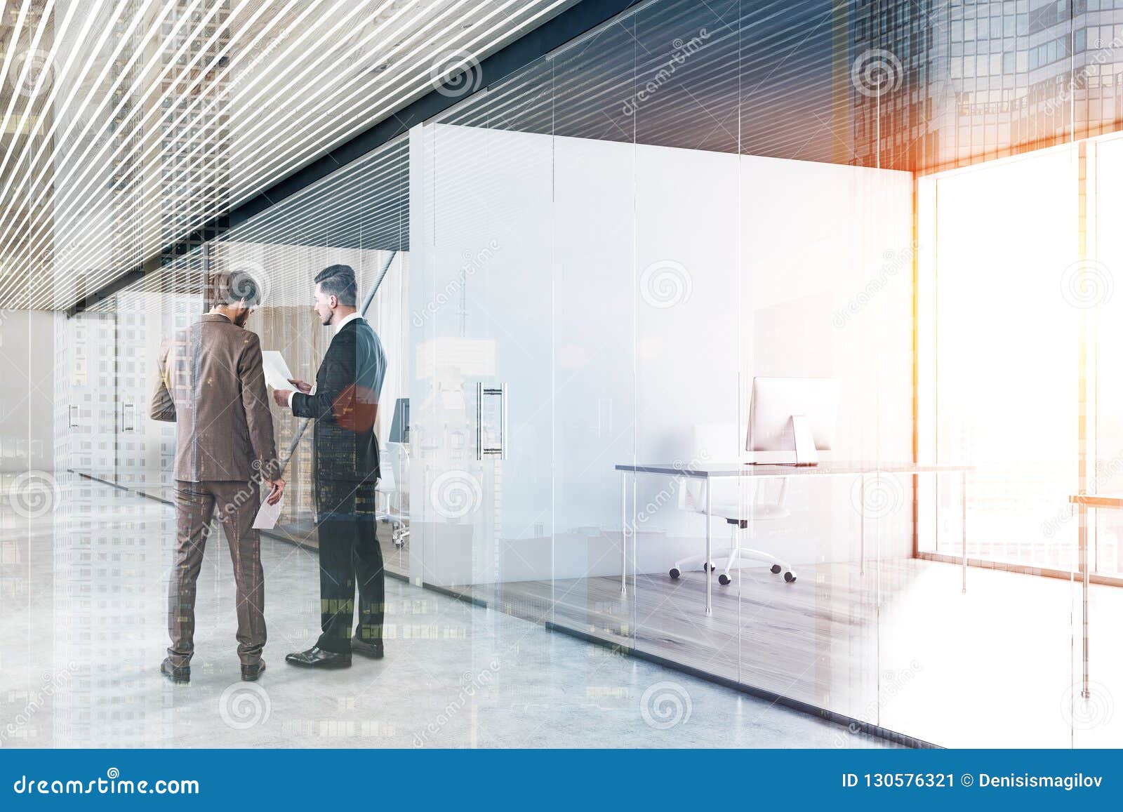 Businessmen In Office Corridor Glass Walls Stock Image