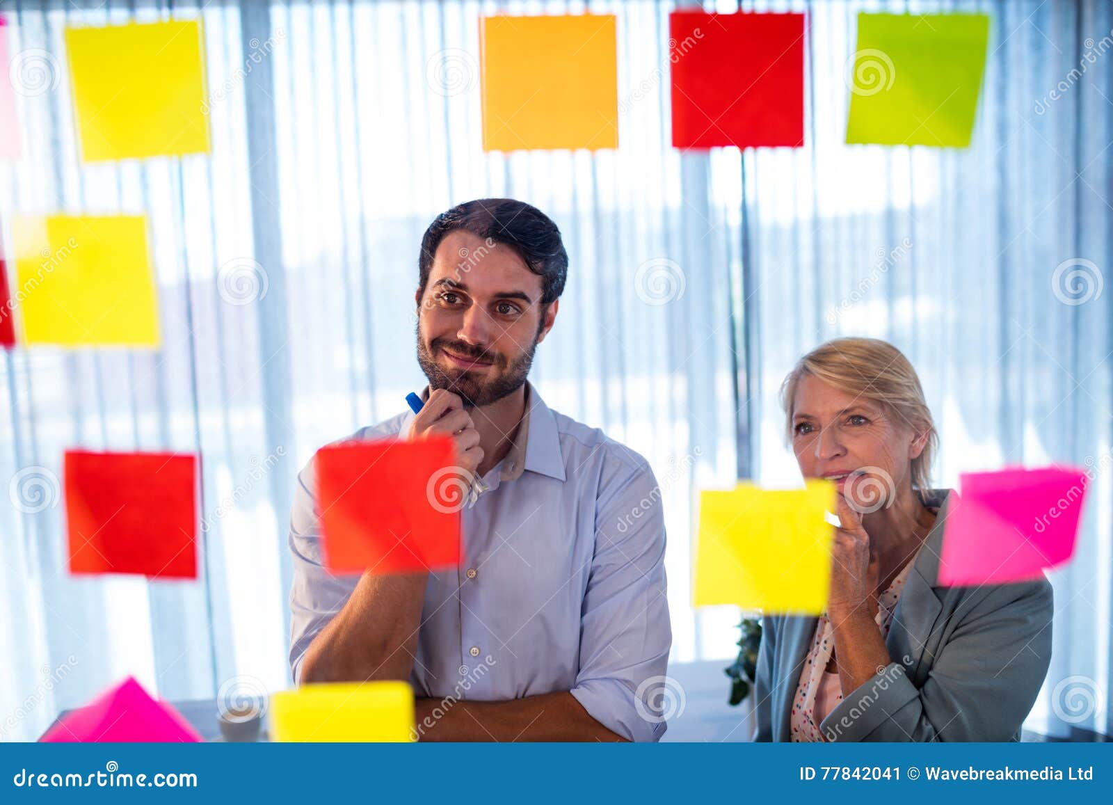 Businessmen Reading Post it Stock Image Image of female