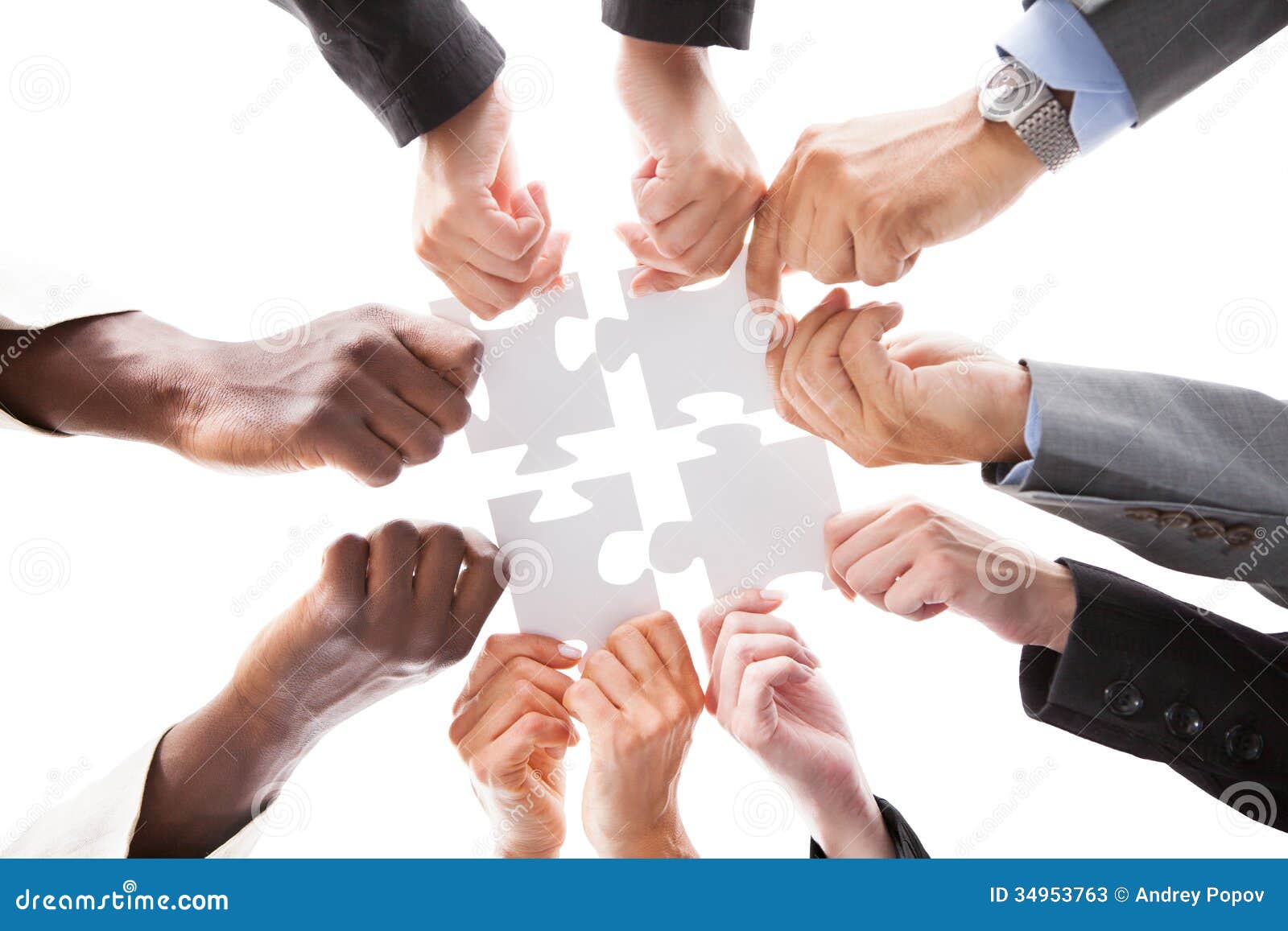 businesspeople holding jigsaw puzzle