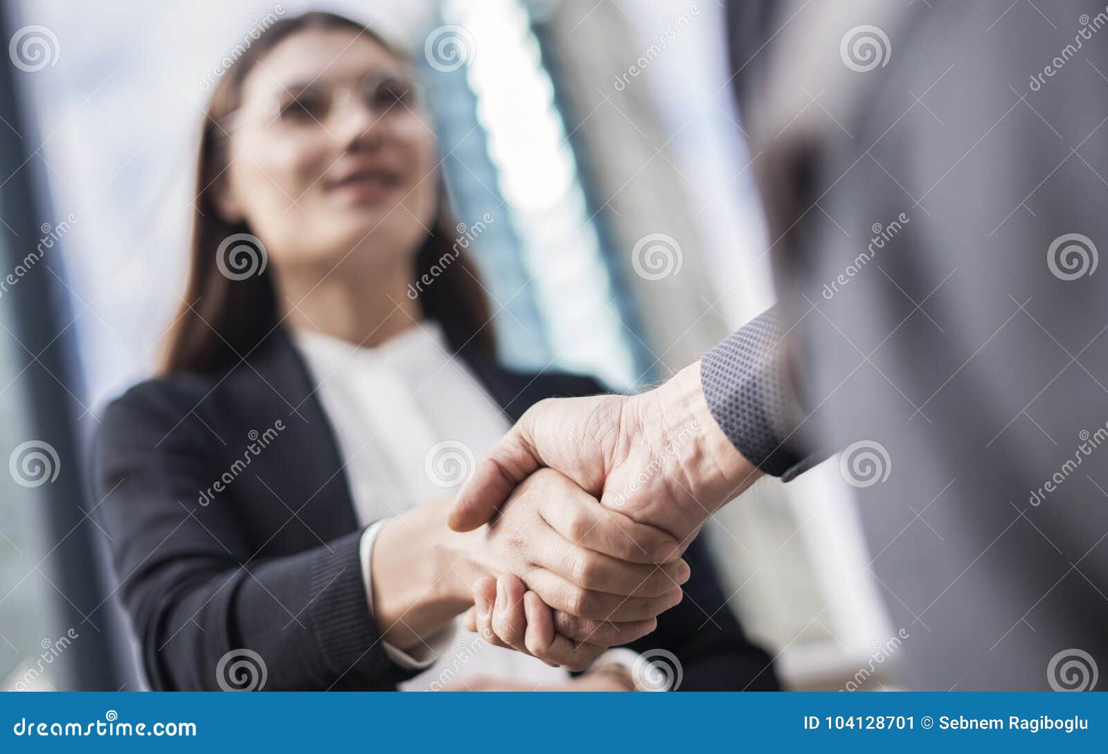 businesspeople making hand shake in the city