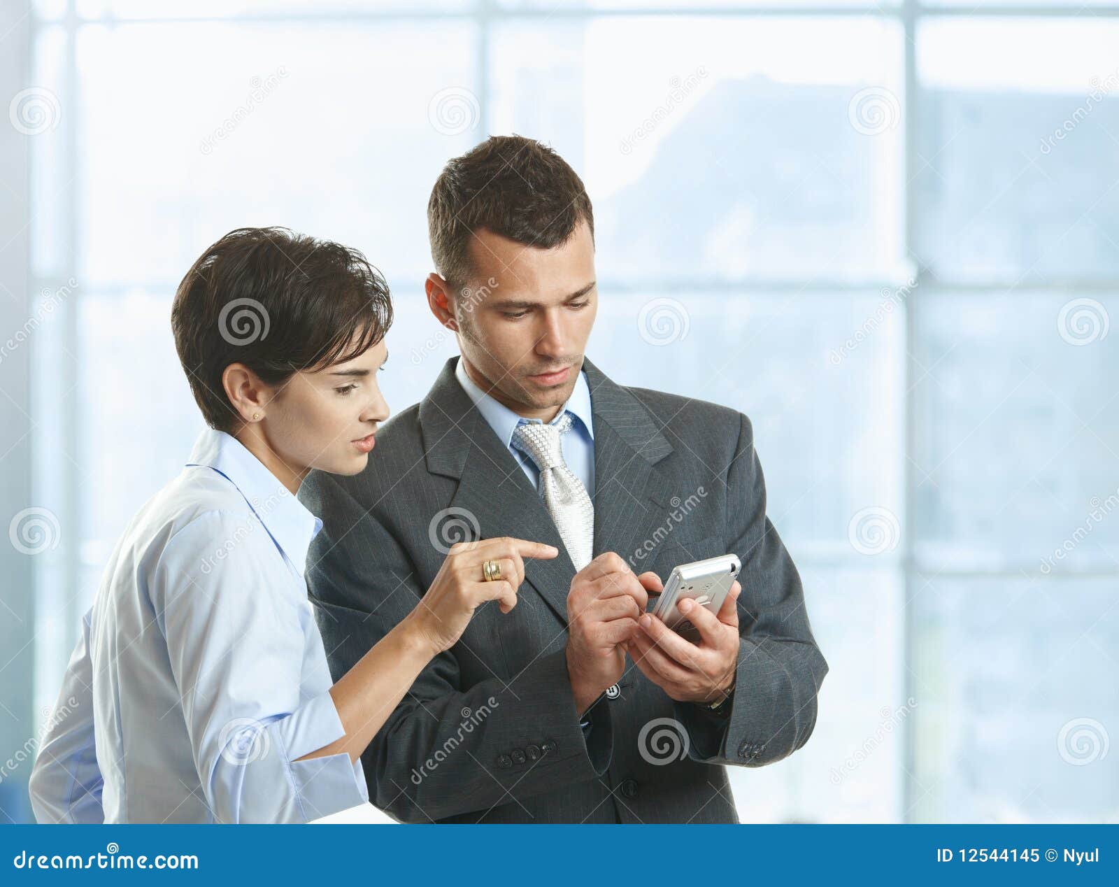 Businesspeople Using Mobile Stock Image Image of indoor, metal 12544145